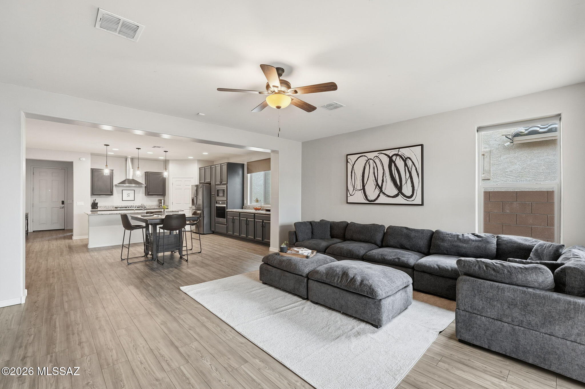 Don't wait--this better-than-new Pulte Barletta offers a rare low assumable rate! Featuring 3 bedrooms plus a versatile den, this home blends modern style with effortless living. Tasteful accent walls and chic barn doors add a contemporary touch, while the low-maintenance backyard shines with lush turf and stylish pavers--perfect for relaxing or entertaining. All appliances are included--washer, dryer, refrigerator, water softener, reverse osmosis system, and home security system--making this home truly move-in ready. Located in the sought-after Rocking K community, you're a short walk to the new Saguaro Creek K-8 and just steps from Rocking K Park.