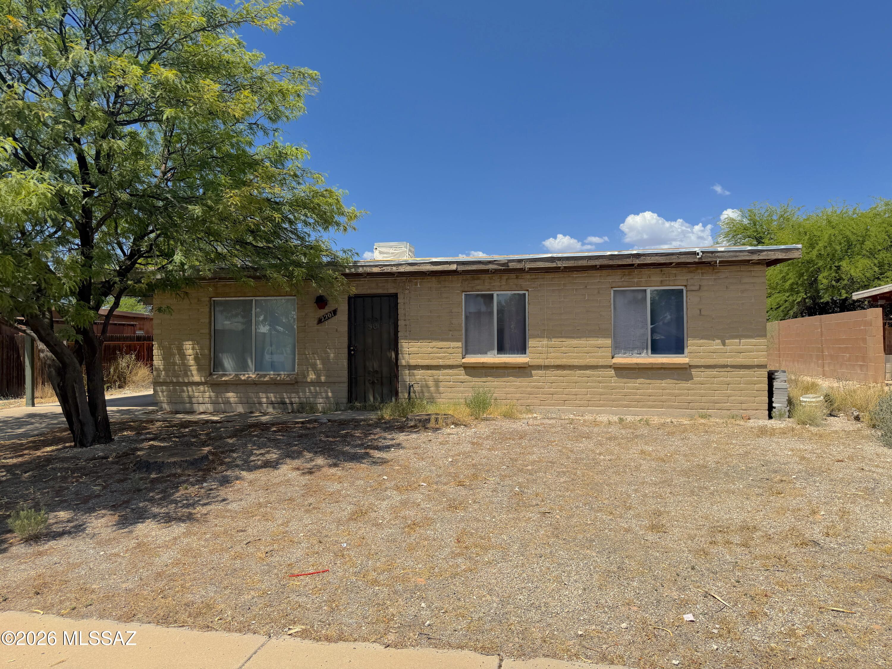 INVESTOR SPECIAL! Bring your toolbox, design plans and dreams.  3 bedrooms, 1.75 bathrooms and 1,058 sq ft with attached carport.  Yes, it needs work and fixing up.  However, this house has good bones and you can make this your own. Primary bedroom with 3/4 bathroom. Large backyard with Arizona room off the back of the house. Laundry room and storage in the carport. Close to schools, shopping & restaurants. Only 5 minutes to the freeway. Come make this home shine again!