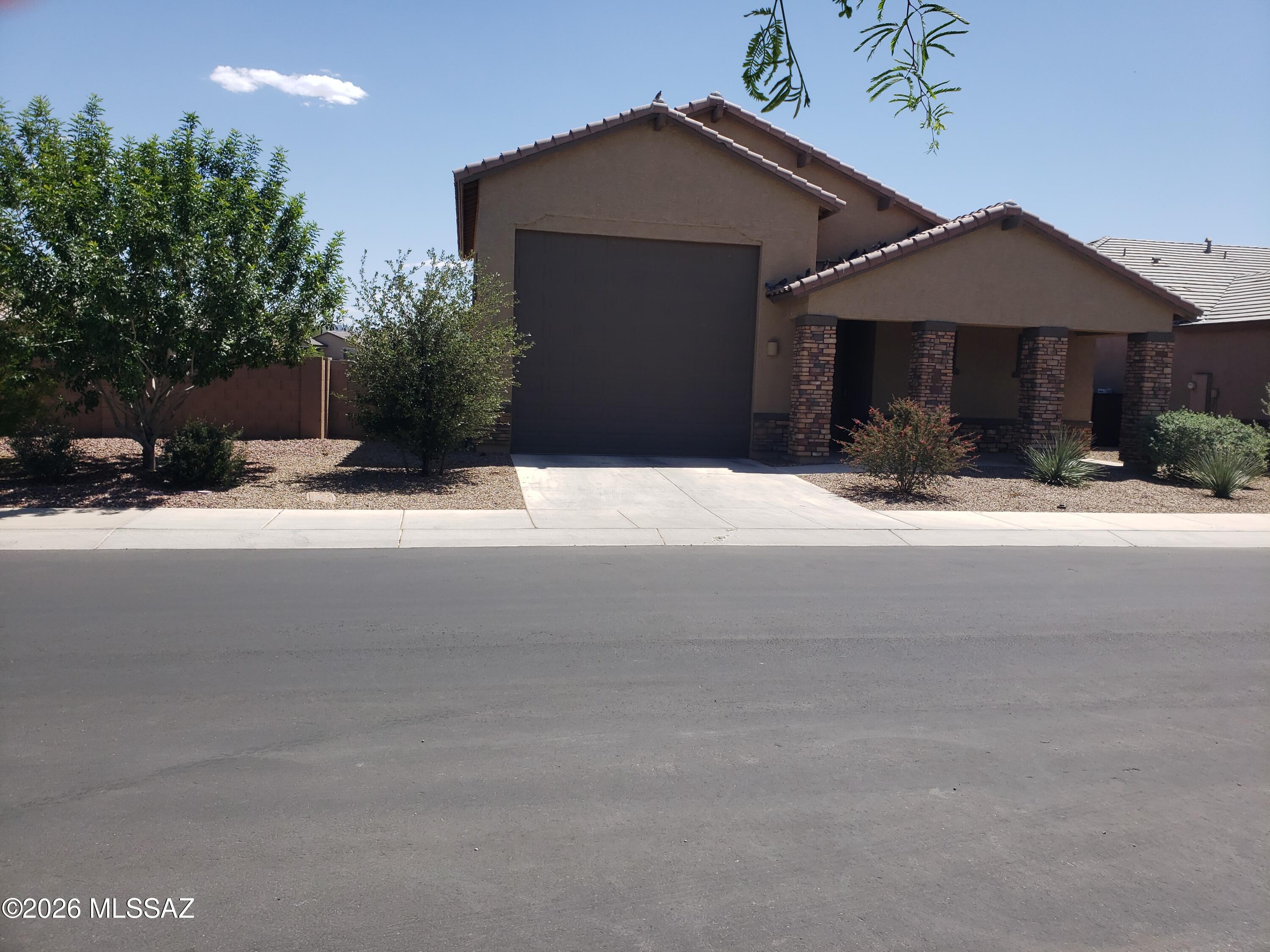 Welcome home to this less than 4 yr old, lightly used, like new Lennar Tortolita model featuring 2183 sqft. of living space in this greatroom concept foorplan w/10' high ceilings & dual pane windows, 3 bedrooms, 2 baths & a 4 car tandem/RV garage/workshop w/soaring ceiling, see floorplan, all on an elevated premium .184 acre lot backing to a large common area w/no street behind. Extras include Granite counters throughout, center island & double oven in kitchen area, tankless hot water, ceiling fans, security wrought iron front door, ring doorbell, rolling back patio shutter, not far from Paws 'n Claws park & much more.