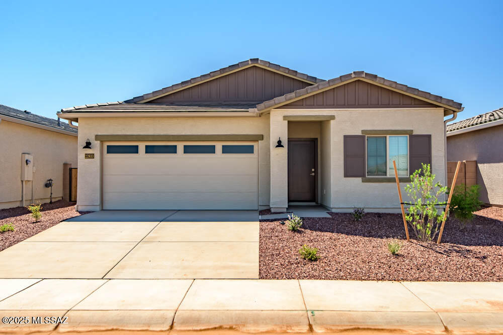 The Amado plan by LGI Homes is a must-see! This home is meticulously crafted with a focus on both style and functionality. This three-bedroom, two-bathroom home showcases a thoughtfully designed layout that exudes comfort. The family room seamlessly connects to a beautifully upgraded kitchen, creating an inviting space for daily living and entertaining. Nestled in a tranquil corner, the master suite offers a haven of serenity and seclusion. Two more bedrooms provide ample space for your family or guests to relax in their own comfort. Better yet, this home is located in the amenity-packed community of Red Rock Village. You will love calling this area home!