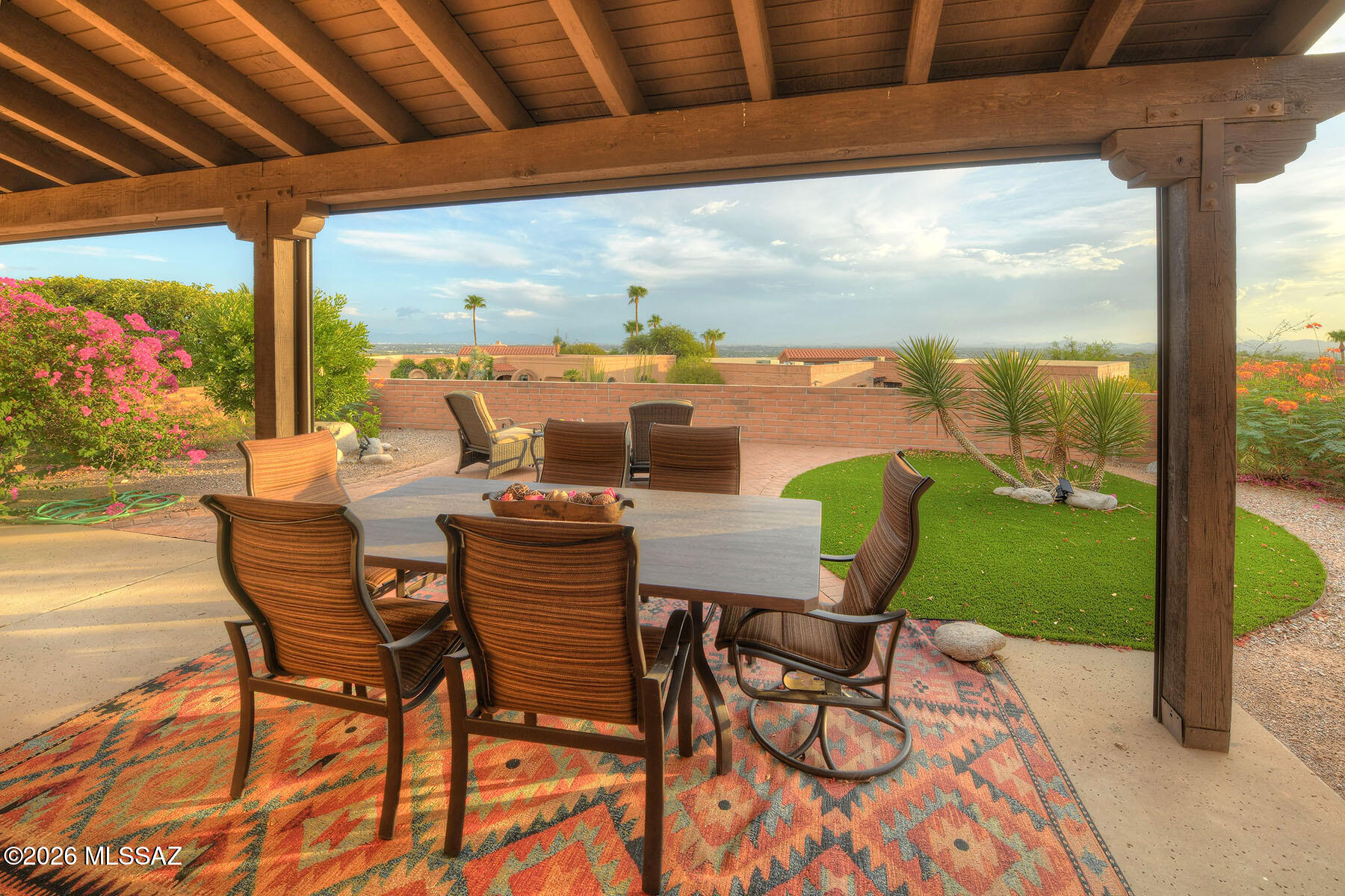 DON'T MISS OUT on this 2BD, 2BA townhome in the Foothills! Experience luxury living w/fabulous kitchen remodeled and featuring high end stainless appliances, white shaker style cabinets, quartz countertops, custom tiled backsplash, and designed to be bright and open with lots of natural light! Kitchen opens to expansive great room featuring high ceilings and a gas fireplace! Next to the kitchen is a room that could be a large formal dining room or separate den! The professionally landscaped backyard is low maintenance w/beautiful pavers, artificial grass & drought tolerant plants that thrive in Tucson climate! The patio offers amazing views day & night!