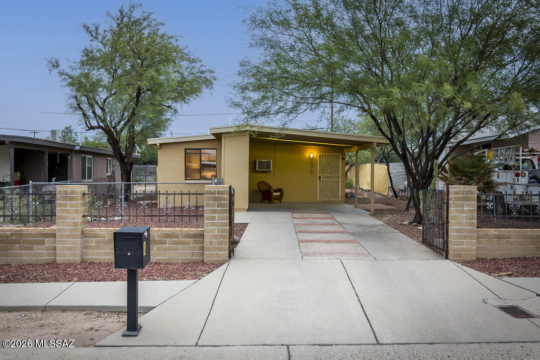 Located in the Barrio Blue Moon neighborhood, this solid masonry-built home offers the perfect blend of comfort, character, and opportunity. Featuring 2 bedrooms, 2 bathrooms, ceramic tile flooring throughout, and light-filled living spaces, the home is designed for easy everyday living. The open kitchen flows seamlessly into the dining area and spacious living room, creating an inviting layout for gathering with family and friends. A new central air conditioning system, complemented by evaporative cooling, provides year-round comfort and energy-efficient cooling options.

The generously sized backyard, complete with alley access, presents outstanding potential for an accessory dwelling unit (ADU), guest house, workshop, or additional outdoor living space. A fully fenced yard provides privacy, while covered off-street parking and attached storage rooms add everyday convenience.

Ideally situated just minutes from Downtown Tucson, the Mercado District, Pima Community College, and the University of Arizona, this location also offers quick freeway access and a neighborhood park just around the corner. Whether you're looking for a primary residence, an investment opportunity, or a property with room to grow, this home offers exceptional value in one of Tucson's most convenient and central up-and-coming neighborhoods.