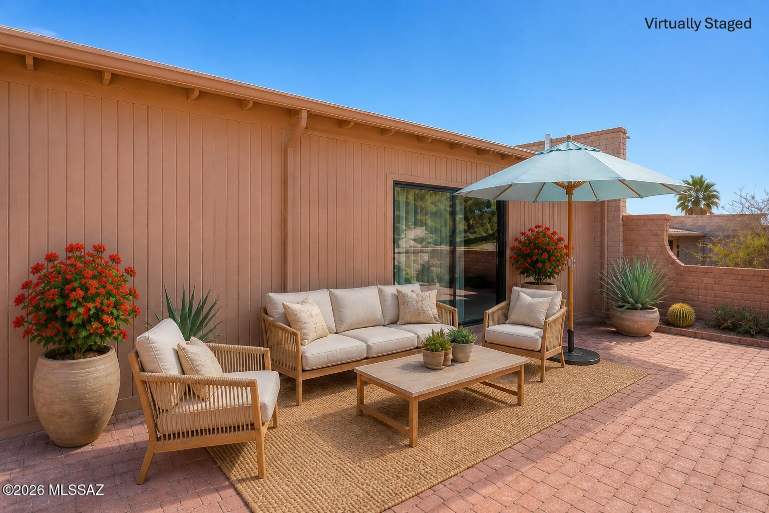Act fast, this inviting townhouse nestled in a unique subdivision has just had a price improvement! Easy living + this townhome offers an exceptional lifestyle experience. Perfect for a year-round residence or a seasonal retreat within a retirement community. A delightful property boasting 2 bedrooms & 2 bathrooms, with a split bedroom plan for enhanced privacy. The primary suite has direct access to the Arizona Room, which provides a serene space to relax & enjoy.  Step into the spacious great room, illuminated by natural light through beautiful skylights, complemented by a dining area that invites you to entertain with ease. The kitchen features stainless steel appliances and an additional in-kitchen dining area, that is perfect for casual meals or morning coffee. A convenient laundry closet houses a washer and dryer. Additional storage is available in the carport, keeping your space clutter-free. The townhome's Arizona room opens to an outdoor patio area, creating a private oasis for you to unwind. Enjoy Arizona's lifestyle with exclusive access to amenities such as pickleball, golf, pools, spas, walking trails, and hiking paths, all at your doorstep. This vibrant property offers a blend of comfort & convenience to suit your active lifestyle. Your Arizona Dream Home awaits.