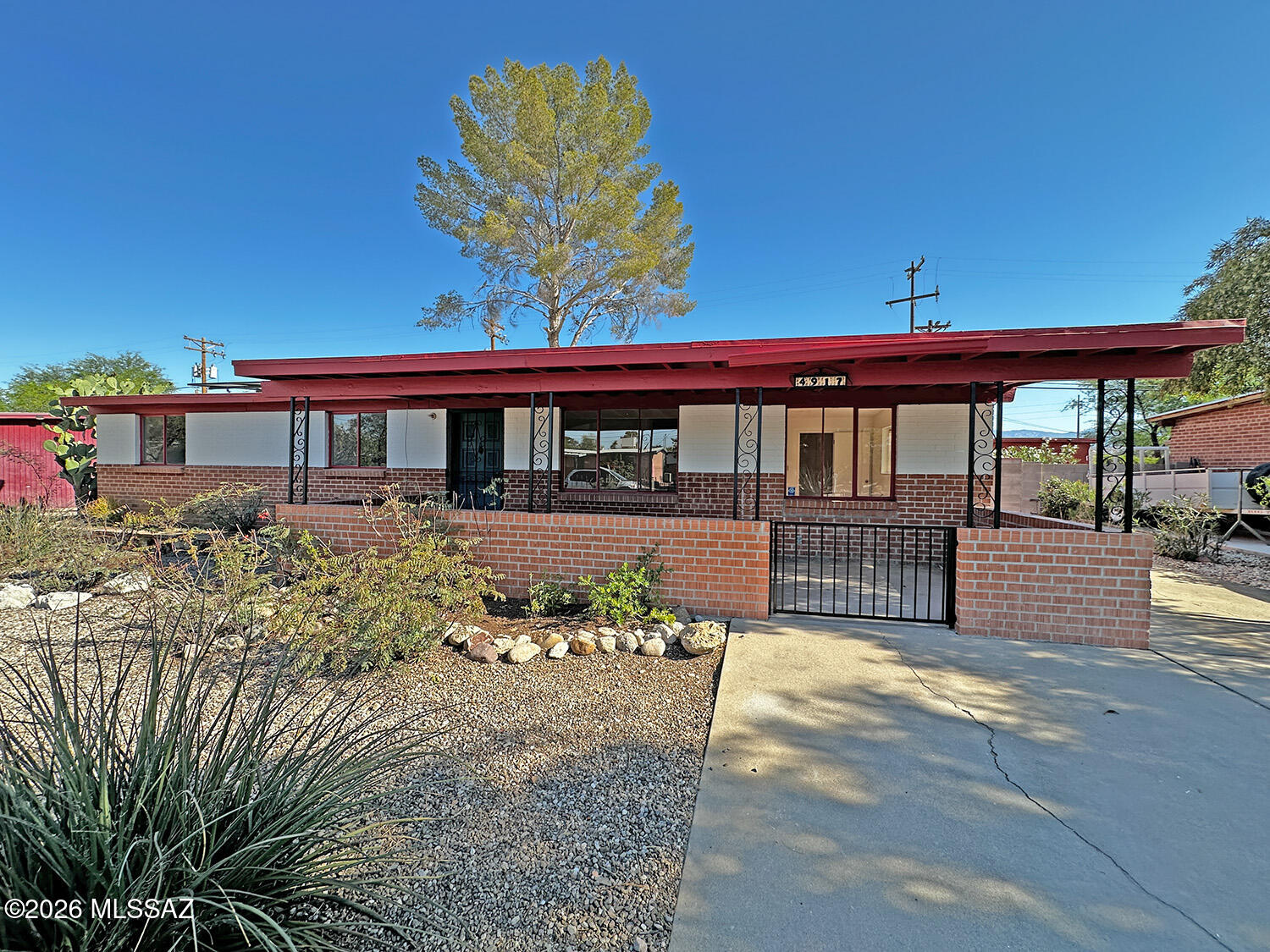 Solar is paid off! This affordable 3-bedroom, 1-bath home features a beautifully updated kitchen with new cabinets and countertops, freshly painted, plus flexible living spaces including a bonus room off the living room and a large north-facing room off the kitchen. The spacious yard offers a built-in BBQ, two storage sheds, and thoughtfully designed landscaping in both the front and back yards. Conveniently located near coffee shops, restaurants, and everyday amenities, this home combines comfort, functionality, and value.