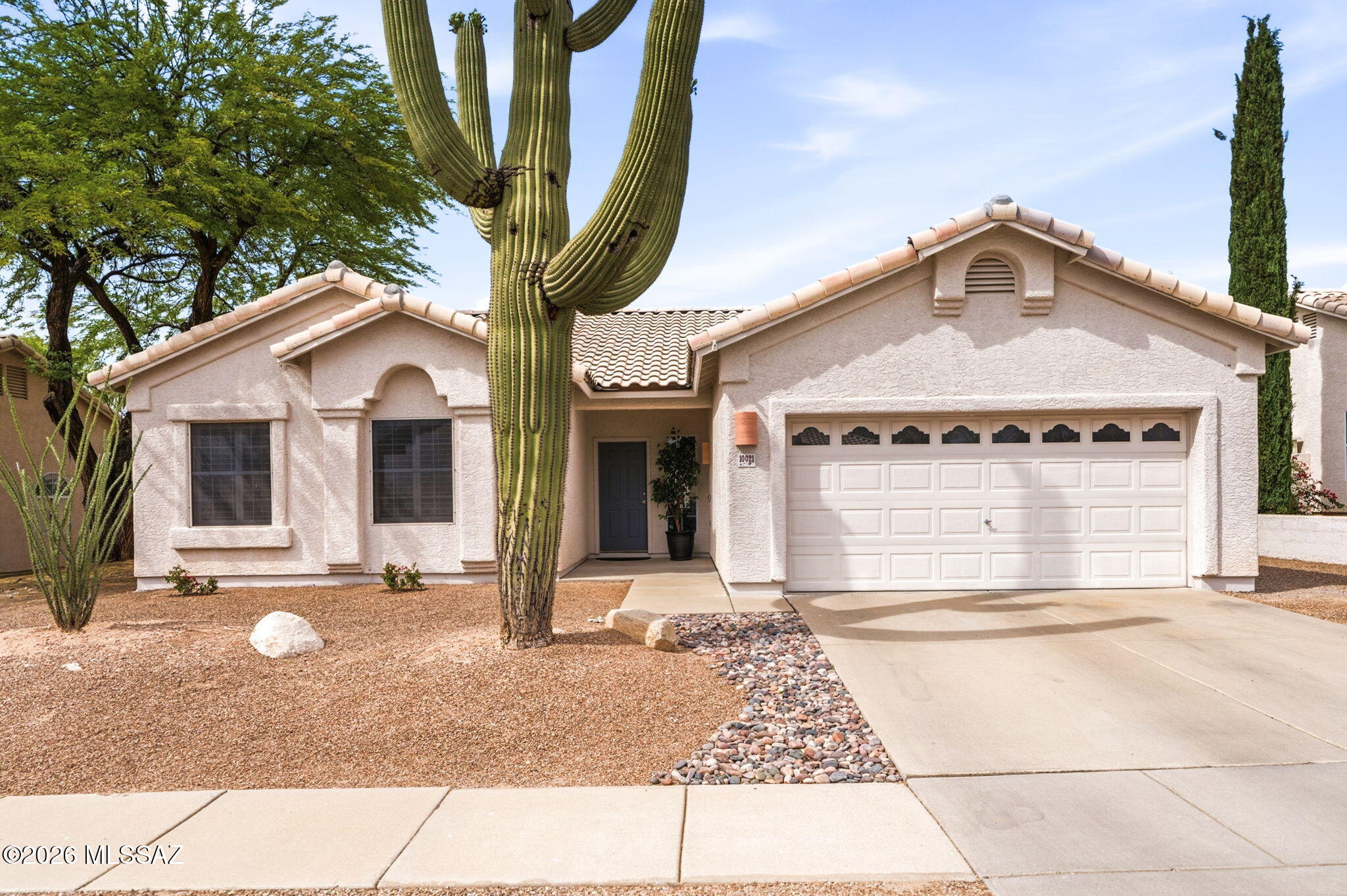 Welcome to 10021 E Paseo De La Masada in the sought-after Rita Ranch community! This well-maintained home features an open and functional floor plan with spacious living and dining area, perfect for everyday living and entertaining. The kitchen offers ample cabinetry and counter space with a seamless flow into the main living area. The primary suite provides a comfortable retreat with an en-suite bath and walk-in closet. Additional bedrooms are versatile for guests, office, or hobbies. Enjoy the retreat like backyard with covered patio. Conveniently located near parks, shopping, dining, and easy access to I-10, Davis-Monthan AFB, and top-rated Vail schools. Owner/agent. Seller is licensed to sell real estate in the state of Arizona.
