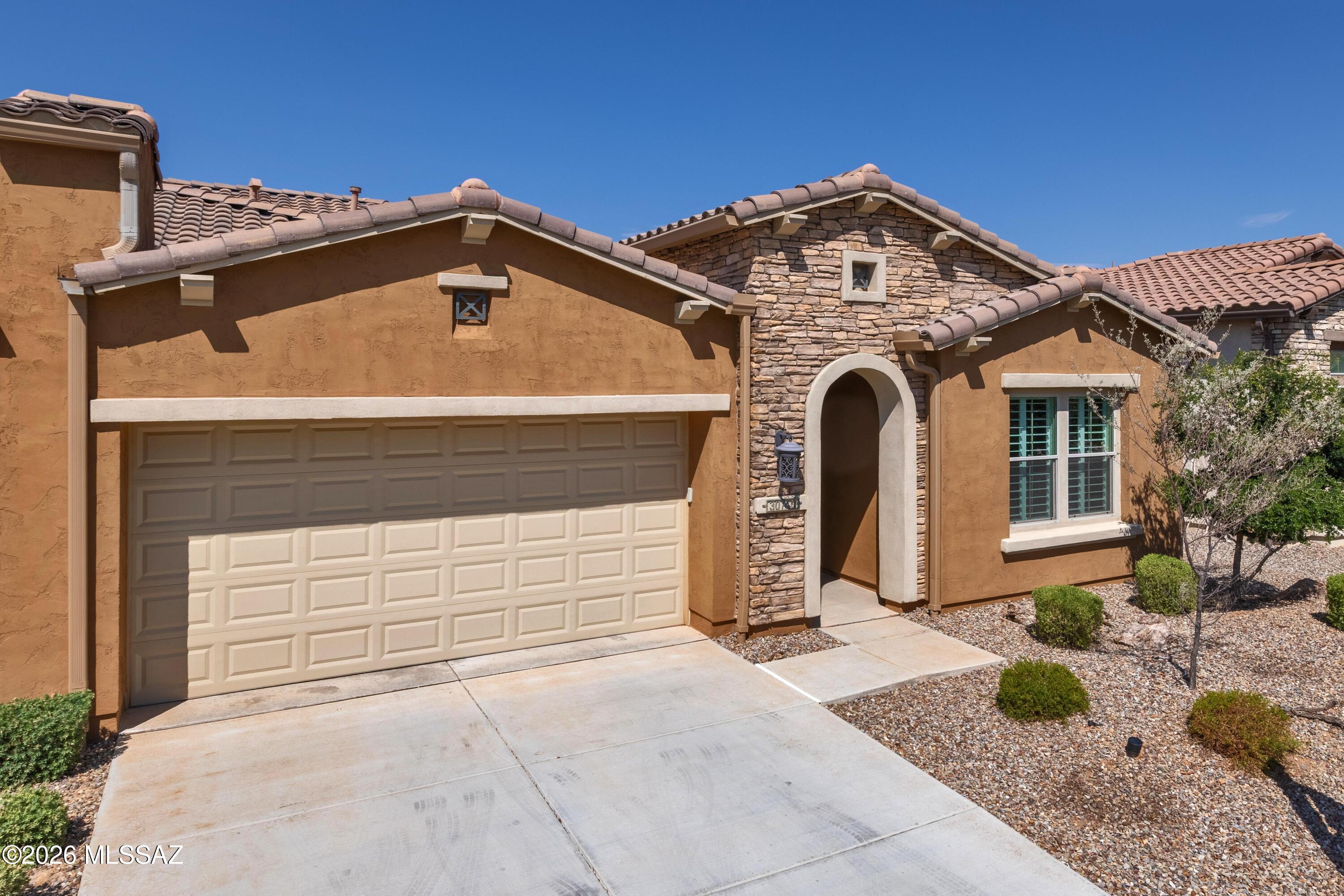 This is a beautiful 1707 Sq. Ft. Viva Villa Exterior Design __ built in 2020 that looks over a gorgeous Arroyo with a walking path.  This home includes 2-Bedroom En Suites, Great Room w/Media Alcove, Dining Area, Spacious Den, Grand Kitchen Island w/Walk-In Pantry, Optional Powder Room, Separate Laundry Room, 274 Sq. Ft. Covered Outdoor Living Space, Deel 2-Car Garage, 9' & 10' Ceilings, and a 214 Sq. Ft. Enclosed Private Courtyard with gate.  The buyer has the incredible option of buying this unit and the attached unit as both are owner by the same individual = truly an investor's dream!