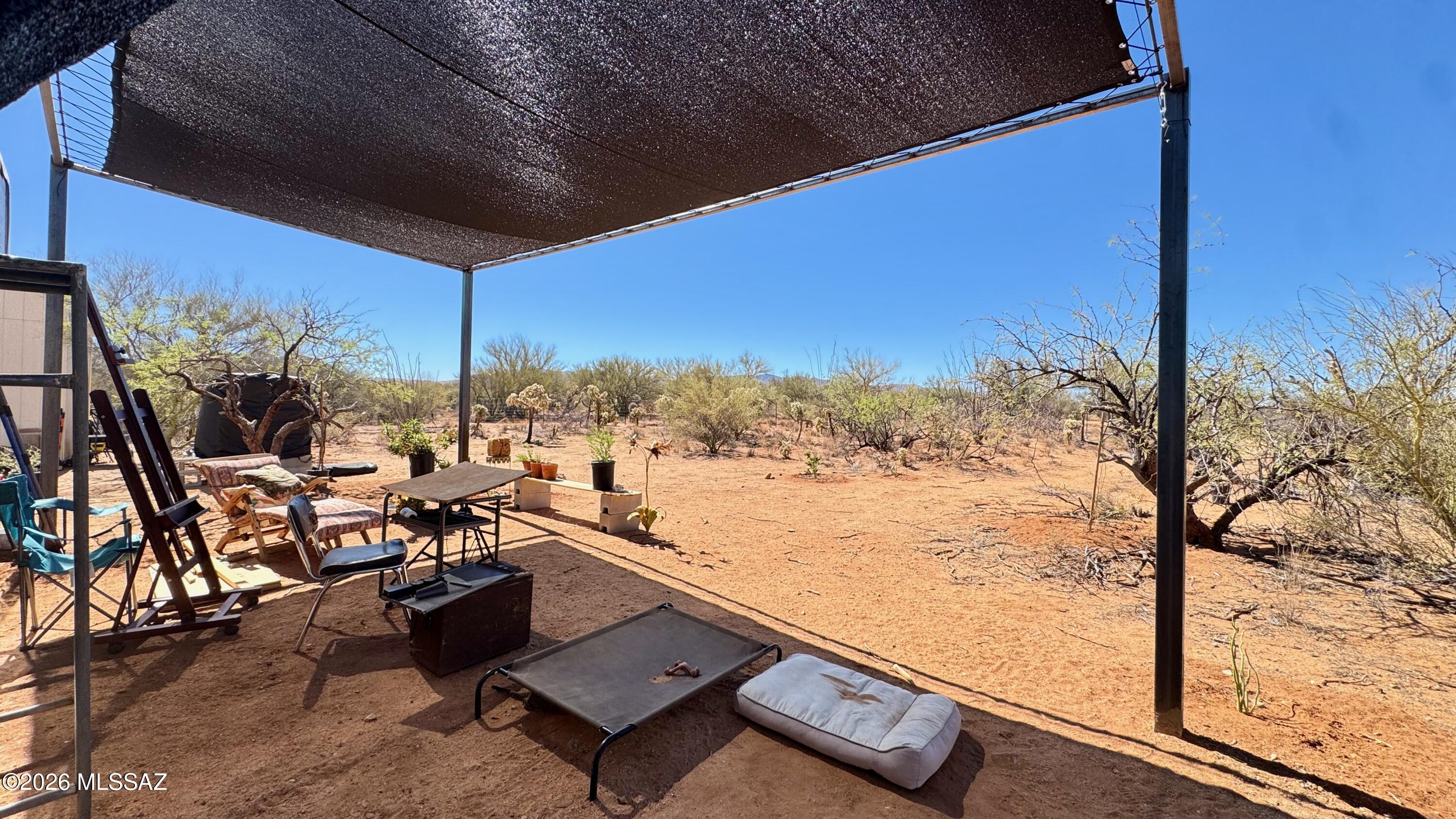 Welcome to Diamond Bell Ranch, where true Western freedom and breathtaking desert landscapes meet. This exceptional real estate opportunity features two side-by-side lots being sold together, offering a generous combined footprint of 2.69 acres. Positioned as an ideal blank canvas for self-sufficient living, this expansive property is the perfect destination to build an independent, off-grid homestead completely free from city restrictions. The acreage comes partially fenced and is uniquely equipped to jumpstart your development, as both a functional lean-to structure and a durable storage shed convey with the sale. To establish your ultimate homestead, simply bring a hauled water system, set yourself up with propane, install your custom solar grid, and you are completely set. The natural setting is spectacular, delivering sweeping, panoramic mountain views and front-row seats to legendary Arizona sunsets that paint the desert sky every single evening. If you are looking to finish an off-grid dream, these two combined parcels offer the space, privacy, and rugged independence you've been searching for.