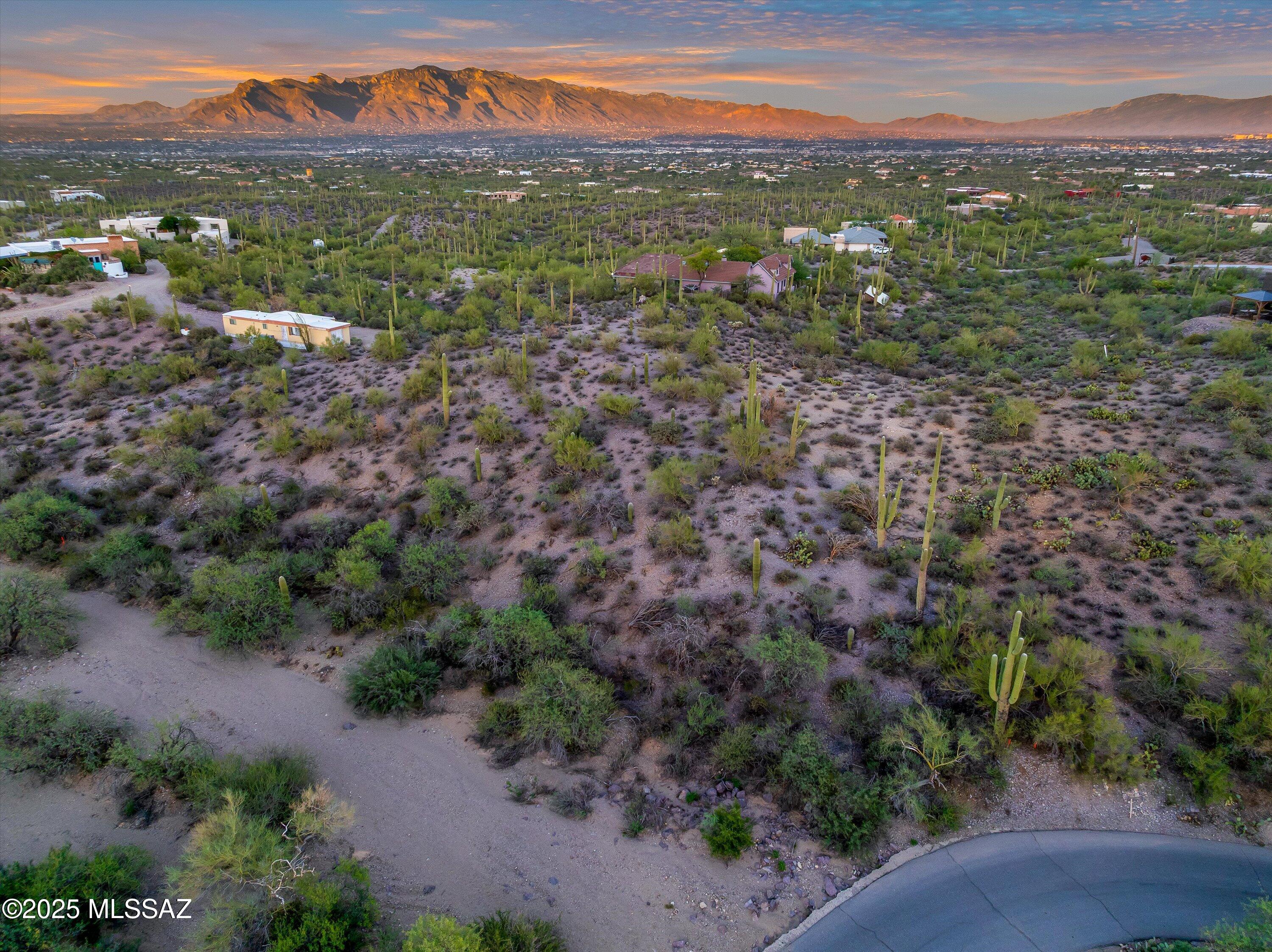 Looking for the best view lot in the Tucson Mountains?  Breathtaking Tucson Views!  Build your dream home on 4.53 acres of prime land nestled in the highly sought-after Tucson Mountain Foothills. Commanding sweeping views of the Tucson Valley and surrounding mountain ranges, this site surely checks all your boxes. Enjoy the feeling of being on top of the world, yet only minutes from Downtown, restaurants, supermarkets, shopping, I-10, world-renowned hiking/biking trails and hospital. Your new dream homesite has gas, electric, and city water available (septic needed) -- ready for your vision to come to life!  Enjoy the incredible city lights, majestic saguaros, and breathtaking beauty in every direction.  Walk up from the street and you'll fall in love instantly. Experience stunning panoramic views of every mountain range and the sparkling Tucson city lights below alongside peace, quiet and privacy. Nestled in a small neighborhood of just 6 parcels- all homes built priced over $1million! This peaceful, private location offers plenty of space for a custom home, guest house, horses, or whatever you imagine. With two potential building sites guaranteeing spectacular mountain and city views, you can choose your ideal setting: the hillside near the wash, perfect for wildlife watching, or the gently sloped site ideal for a home, guest house, workshop or corral. SR zoning allows a wide variety of options- make sure to verify your desired uses with the county as part of your due diligence. This property offers paved access- Volunteer Road Maintenance Agreement in place to ensure road upkeep and has been recently surveyed/staked. Percolation test completed back on 1988 when purchased- was a pass but results may be obsolete at this time.
A truly magnificent homesite.. come see it today!