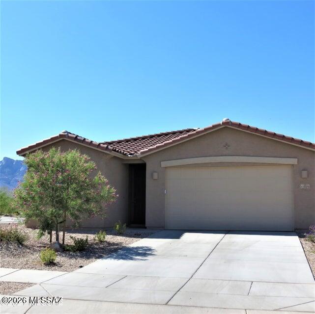 Wow - Awesome View - this 3 bedroom plus den & 2 full bathrooms, built in 2019 and offers great room design, very spacious kitchen with granite counters and large center island, gas range, large walk-in pantry, master bedroom has separate walk-in closets, double vanities and walk-in shower, neutral colors throughout, tile in all the right places, 2.5 car garage, covered patio and backyard with excellent Catalina Mountain View. This property will be clean and ready by 07/01/2026.