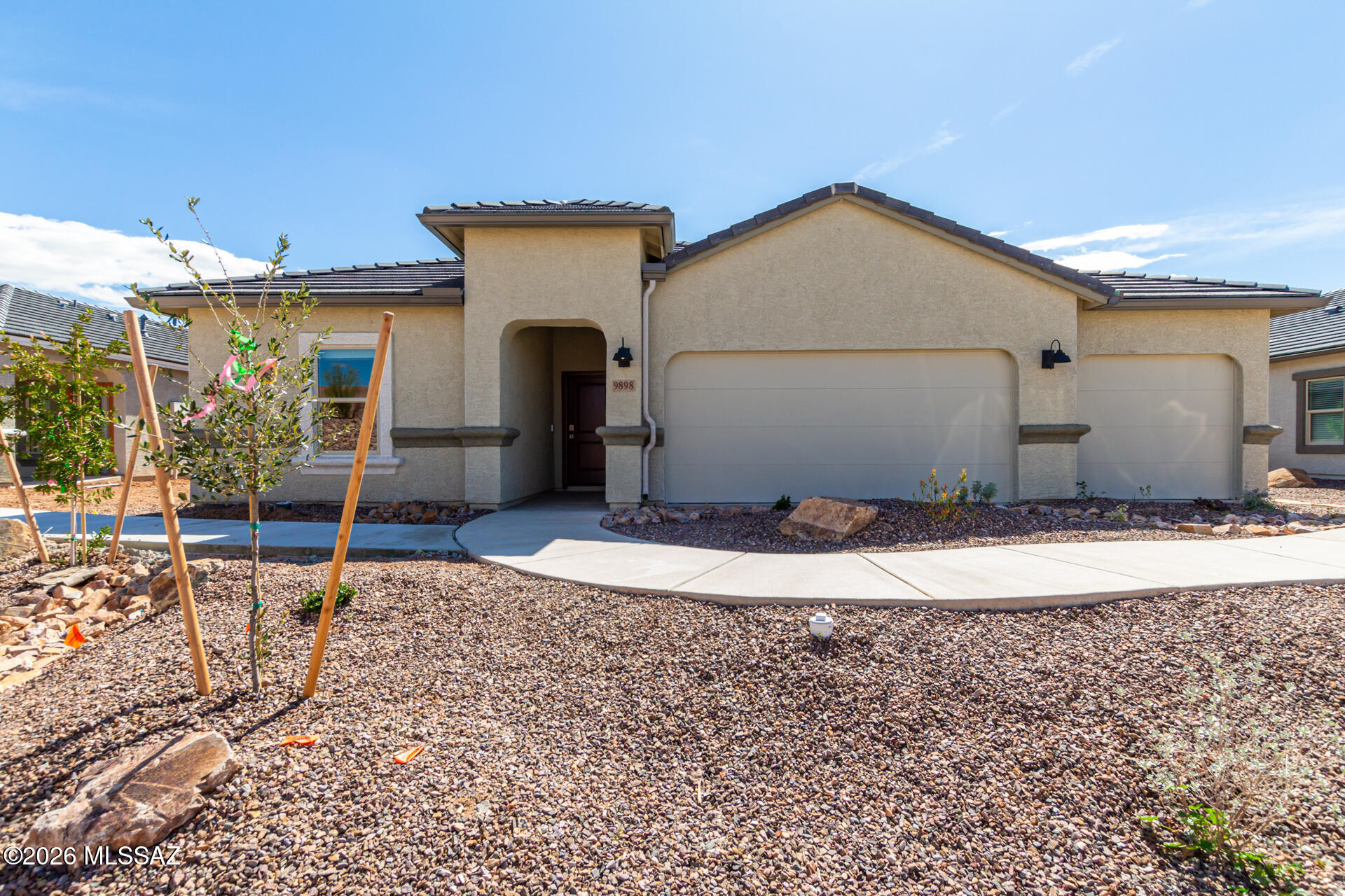 Welcome to the Kingston, a stunning 2051 sq. ft. single-story home now available in the newest phase of Saguaro Bloom Acacia 65s. This popular floor plan features 4 bedrooms and 2 bathrooms, thoughtfully designed for modern living. At the entry, you'll find two bedrooms and a hall bath, with an additional bedroom conveniently located off the kitchen. The HUGE primary suite is situated at the back for ultimate privacy.

The open great room design boasts an oversized, angled island and an extra wall of cabinets and counter space, perfect for entertaining and everyday living. We've enhanced this standout plan by replacing two windows and a single French door off the great room with an oversized slider, seamlessly connecting the indoor space to the covered patio. SRAYFOAM INSULATION!