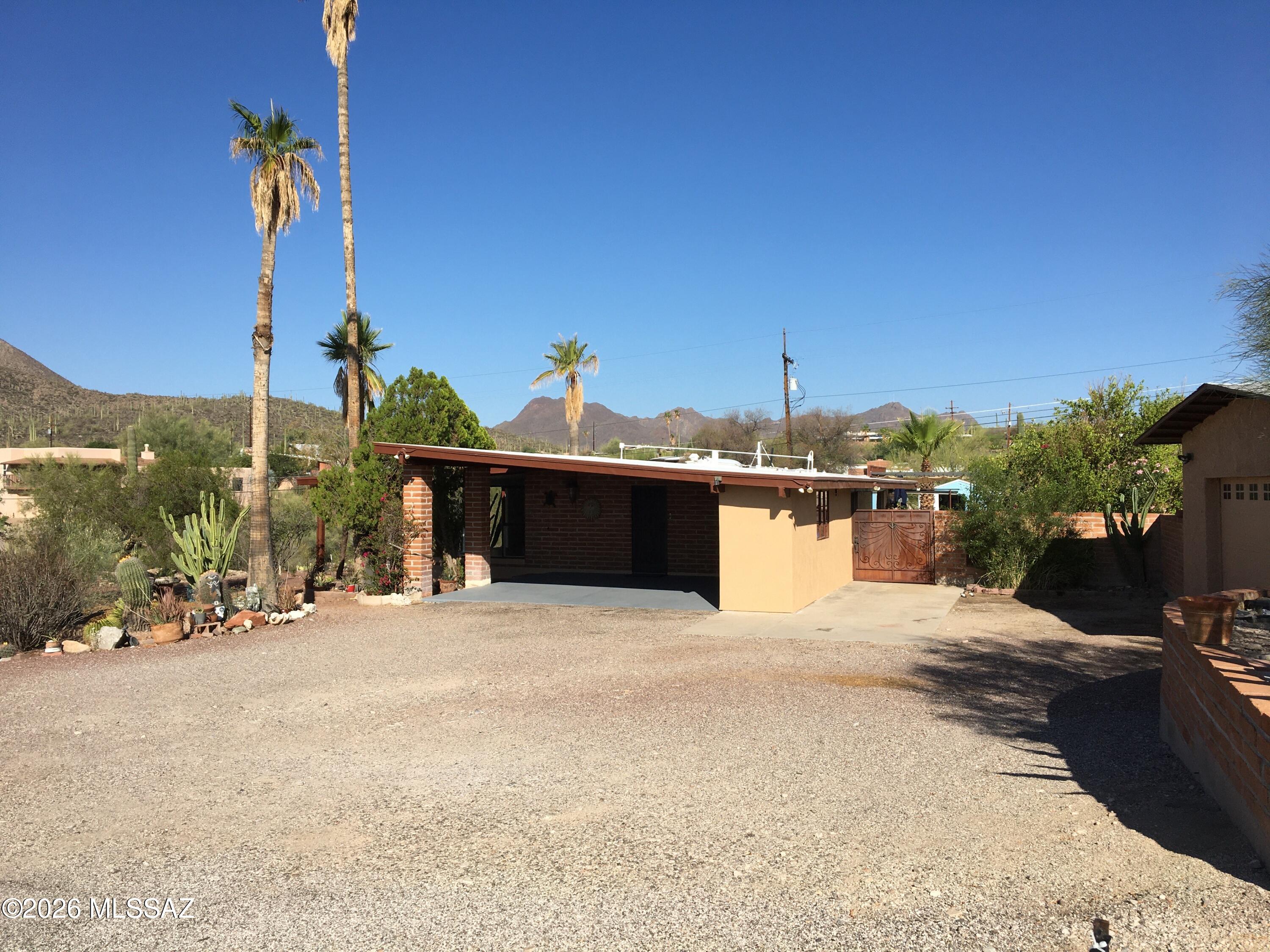 1,680 square foot, 3 bedroom, 2 bath burnt adobe home with Kool Coat roof on .73 acre hillside lot with numerous fruit trees and natural desert landscape.