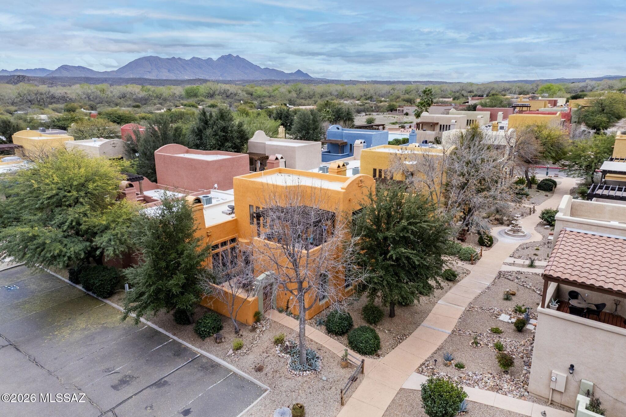 Set in Tubac's Barrio Embarcadero, this thoughtfully updated townhome balances Southwest character with smart, stylish upgrades. Designed for indoor-outdoor living, there's a welcoming courtyard with gas fireplace plus mountain-view sky deck with built-in gas grill. Open-concept interior features great room with fireplace, refreshed kitchen with new cabinetry, refrigerator and sink. Two king-sized en suite bedrooms, one on each level, feature walk-in closets. Additional main floor bedroom and half bath adds versatility for guests, office, hobby space. Major updates include new HVAC (2024), new water heater, upgraded electrical panel, whole-house water conditioner. Embarcadero amenities include pool, spa, fitness studio and walking trail that connects directly to the historic De Anza Trail