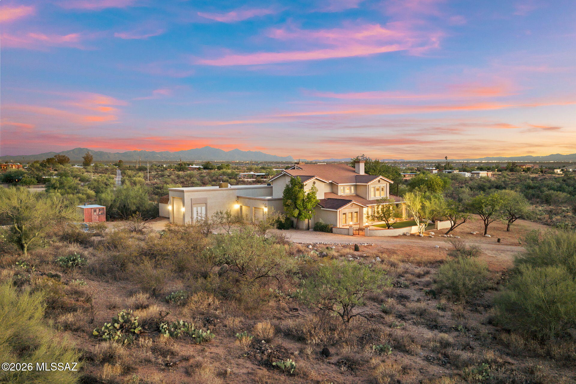 Experience the beauty and tranquility of the Sonoran Desert from this exceptional one owner custom home, perfectly situated on 8.2 private acres surrounded by breathtaking mountain views, towering saguaros, and Arizona's natural beauty. 
Offering 3,547 square feet of thoughtfully designed living space, this 4-bedroom, 3.5-bath residence blends timeless craftsmanship with comfort, flexibility, and the room to create the lifestyle you've always envisioned. 
Step through the front door and be welcomed by rich hardwood flooring, a dramatic grand staircase, and an inviting floor plan designed for both everyday living and effortless entertaining. The main level features two spacious guest bedrooms connected by a convenient Jack-and-Jill bathroom, multiple gathering spaces including both a form living room and a warm family room, each complete with its own fireplace which provide the perfect setting for relaxing or entertaining family and friends.
Upstairs, a spacious loft with its own fireplace creates an ideal second living area or quiet space. The private primary suite is a true retreat, featuring a luxurious spa-inspired bathroom with a classic clawfoot soaking tub perfectly positioned beside a stunning see through fireplace, a large walk-in shower, dual vanities, and an oversized walk-in closet. A second upstairs bedroom includes its own ensuite bath, offering privacy and comfort for guests or extended family.
The  basement adds valuable flexible space that can easily serve as a game room, fitness area, home theater or additional storage.
Outside, the property truly shines. The backyard is designed for enjoying Southern Arizona's incredible weather, featuring a sparkling pool with a cascading waterfall, expansive artificial turf, and sweeping mountain views that create an unforgettable backdrop for outdoor living. Additional turf in the front yard enhances curb appeal while minimizing maintenance.
The oversized two-car garage is complemented by an attached RV garage, providing exceptional storage for recreational vehicles, boats, or workshop space. Three additional storage sheds are strategically placed throughout the property, offering even more room for tools, equipment, and hobbies. 
Zoned for horses, this remarkable property offers endless opportunities to customize your dream estate. Whether you envision equestrian facilities, a detached workshop, gardens, or even a guest house, the acreage provides the space and flexibility to bring your vision to life. Despite its peaceful, private setting, you'll enjoy the convenience of being just minutes from Saguaro National Park, shopping, dining, and everyday amenities. 
This is more than just a home, it's a rare opportunity to own a private Sonoran Desert estate where luxury, serenity, and limitless potential come together.

DO NOT FOLLOW GPS: Take Old Spanish Trail east from Houghton to Avenida los Reyes,Take a right on Avenida Los reyes and take it to the end,Make a left onto Pantano Trail and take it to the end to the brown wooden fence,Make a right at the brown wooden fence to the house on the right.