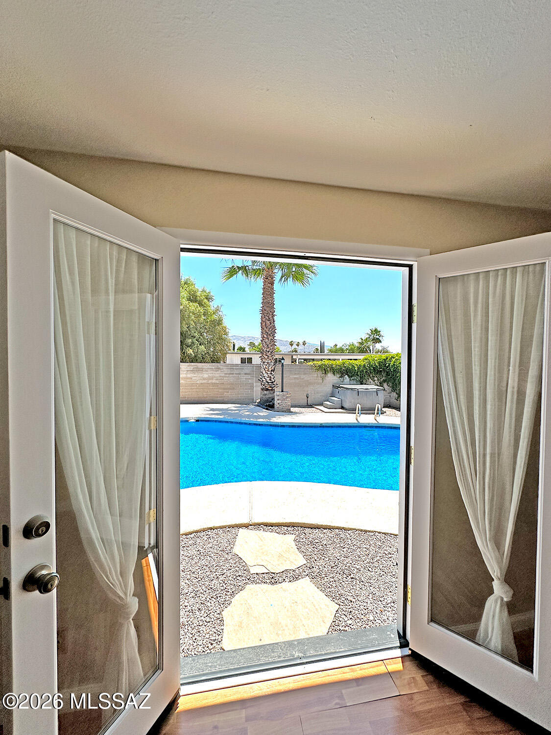 Welcome to this beautifully updated 3-bedroom, 2-bath home in desirable East Tucson--perfectly move-in ready and packed with upgrades! Enjoy ceramic tile flooring throughout, a newly coated roof, and brand-new dual-pane windows that bring in natural light while boosting energy efficiency.
The kitchen features a dishwasher, new refrigerator and a convenient under-sink reverse osmosis system. Additionally, the washer and dryer are new. The primary bedroom has been enhanced with new French doors and an added window, creating a bright and inviting retreat.
Step outside to your private backyard oasis! The yard is tastefully paved and includes a comfortable ramada--ideal for relaxing or entertaining. More... The sparkling pool has just been drained and recoated- perfect for cooling off while enjoying scenic mountain views.
You can also enjoy the hot tub during the cooler nights! Additional highlights include a fully remodeled laundry room with new drywall, a sliding glass door, and added utility sink, plus a 1-car garage for convenience.
This home truly has it all--style, comfort, and thoughtful upgrades throughout. Don't miss your chance to make it yours!