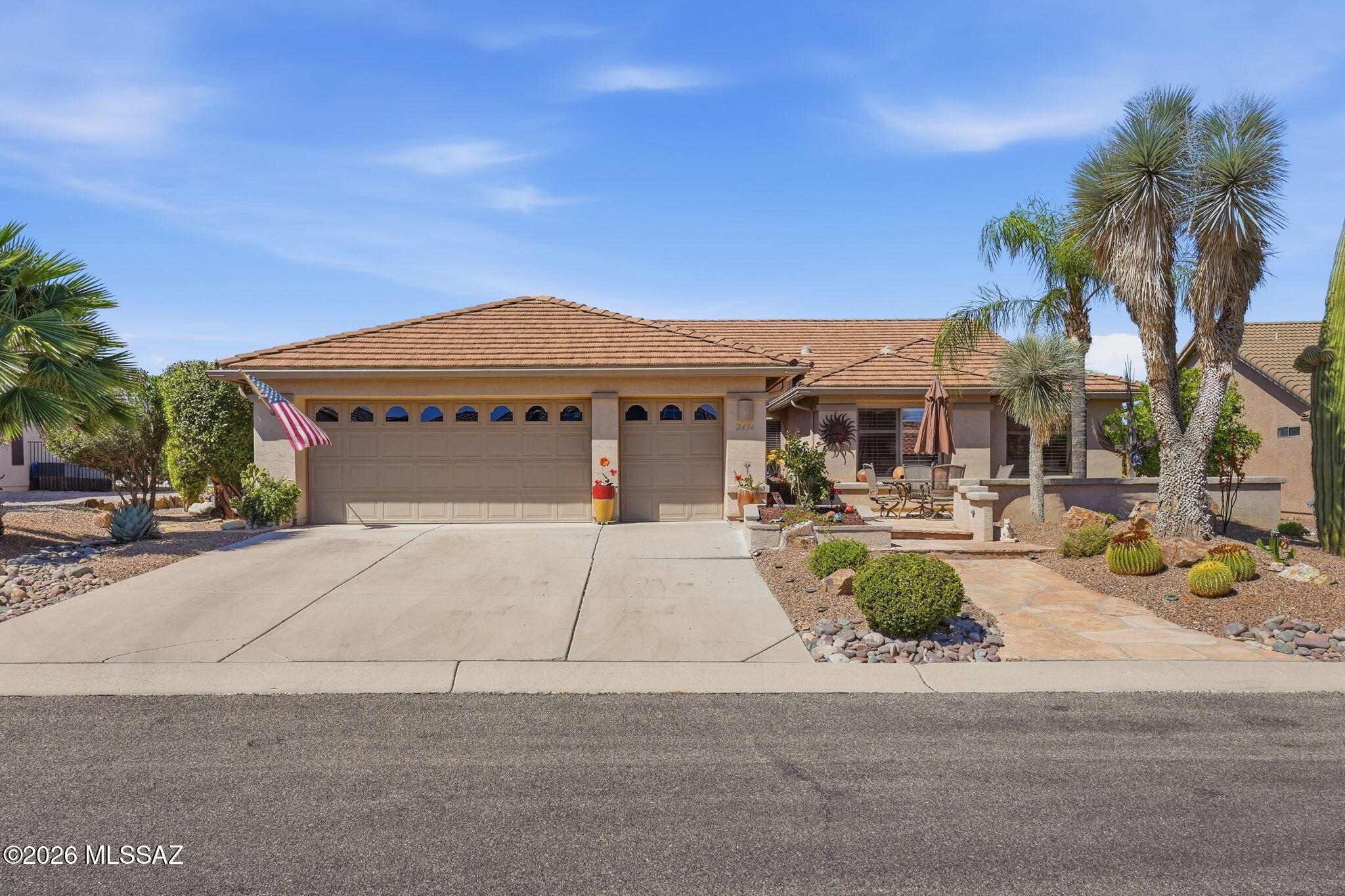 Mountains by Day. Milky Way at Night. Beautifully customized 2,695 sqft, 3-bedroom retreat on one of Quail Creek's most desirable streets. This Overview Lane home offers a peaceful indoor-outdoor lifestyle with mountain views, a private, zen-like backyard, and multiple patio spaces.
A serene garden room off the kitchen opens to two flagstone side patios, creating a perfect space for morning coffee, reading, or entertaining. The spacious primary suite features a bay window, a slider to the back patio, and an upgraded closet with shelves and drawers. Two additional bedrooms and a guest bath offer comfortable space for visitors or family.
The den includes built-in bookshelves and works beautifully as an office, library, or hobby room. The generous great room has space for formal dining and living areas, plus a custom display wall with glass shelving and lighting. The kitchen features granite countertops, pendant lighting, a center island, a breakfast bar, and a built-in desk.
Expanded laundry room includes a utility sink, and pantry storage shelves. The extended 2.5-car garage offers storage cabinets, a workbench, and extra room for hobbies, tools, or a golf cart. Additional features include sunscreens on all windows and thoughtful upgrades. Privately situated with no rear neighbors, this home offers serene desert vistas and picturesque mountain views, and a peaceful Southern Arizona setting -- making it a truly special Quail Creek home.