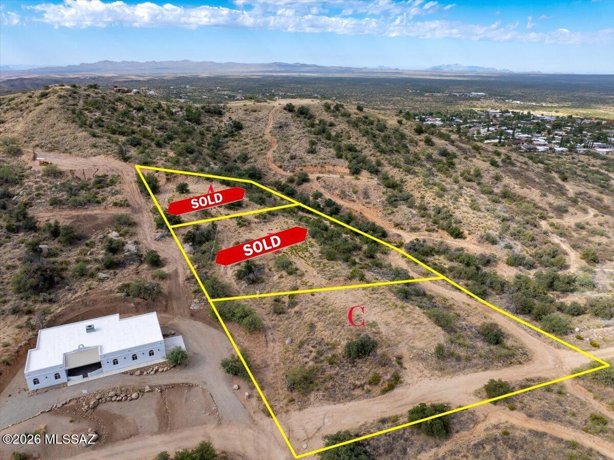 VIEWS, VIEWS, VIEWS, and opportunity await on this beautiful hilltop lot located in the heart of Oracle near 2 o'clock hill. Whether you're looking for a prime spot to build your dream home or seeking a future investment property, this parcel won't disappoint! Boasting .82-acre, water and power at the lot line, potential septic site identified, and potential home plans available, this property is an ideal starting point for immediate construction. This lot is conveniently situated with easy access to nearby highway 77, shopping, schools, and recreational hiking areas. This is fantastic opportunity in the heart of Oracle! Lot labeled C in the photos. the flexibility to build or expand as you wish. Parcel #308-19-090A  is .48 Acres & Parcel 308-19-050B is .54 acres, these adjoining lots can be added to the purchase contract for an additional $20,000 each. Want them all but need a deal? Seller financing available!! Come and make your dream a reality!