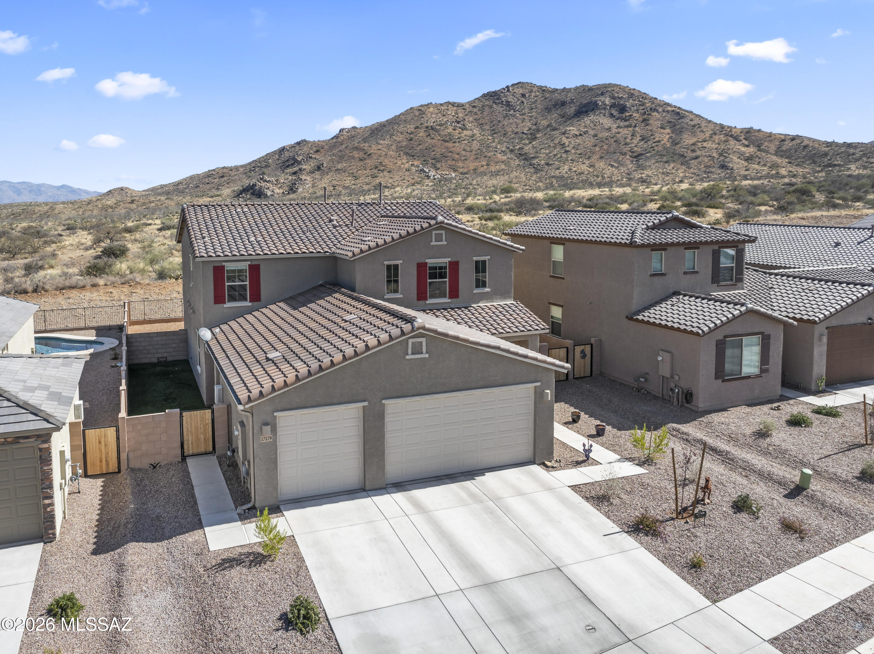 The price is what!  For a NextGen home on premium lot! Situated with no neighbors behind, this property captures sweeping views and a sense of openness that is hard to find. The rear yard is fully landscaped, creating an inviting outdoor space ready to enjoy from day one. The thoughtfully designed layout includes a private 1-bedroom suite with its own entrance and yard, ideal for extended living, guests, or a separate retreat. The main home features 3 bedrooms along with dual living areas, including an upstairs loft and a spacious gathering space off the Super Kitchen.  Move-in ready and designed for versatility, this home offers a unique opportunity to enjoy both privacy and connection in a highly desirable setting