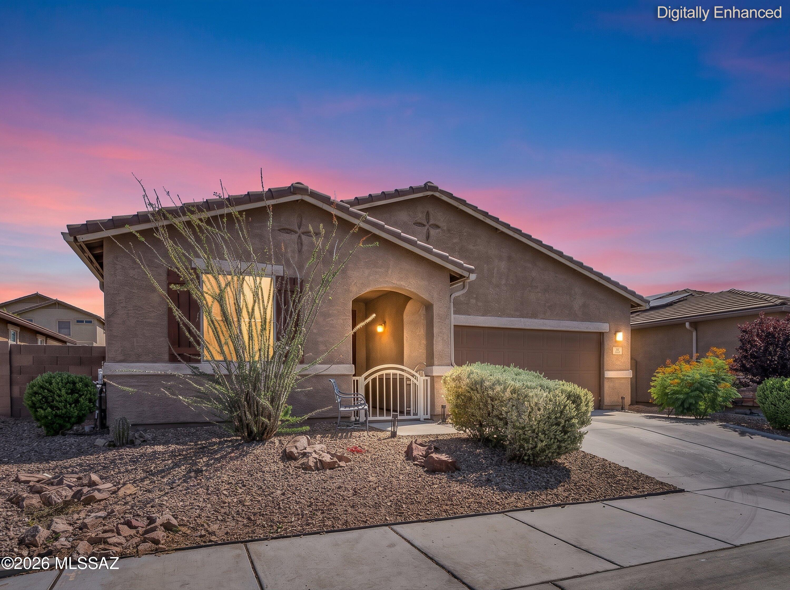 Why wait to build when this exceptional Gladden Farms home is already loaded with premium upgrades? Offering nearly 2,100 sq. ft., this move-in-ready home features 3 bedrooms, 2 full baths, and a spacious game room with a fireplace and elegant indirect lighting--perfect for entertaining, game nights, or relaxing with family and friends. Stylish hard-surface flooring flows throughout the living areas and bedrooms, while motorized roller shades in the family room and two bedrooms add modern convenience and smart-home appeal.
Your private backyard oasis awaits with a charming gazebo equipped with cooling misters and a brand-new hot tub, creating the perfect setting for year-round Arizona living.  -see more- The oversized garage offers an abundance of built-in storage, and owned solar provides energy-saving benefits. Every detail has been thoughtfully upgraded, making this home truly turnkey. Best of all, you'll enjoy a highly desirable location within walking distance of grocery shopping, restaurants, retail, and medical services. Be sure to review the attached upgrades list, there's even more to love!