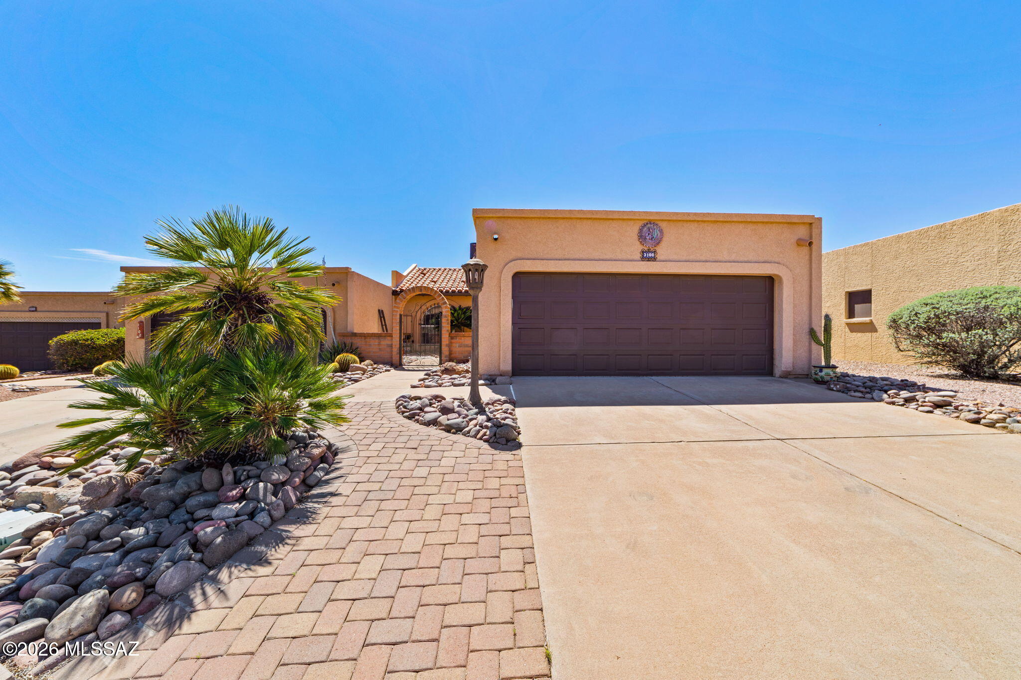 Beautifully maintained home in the southwest area of Green Valley, close to shopping, dining, and local amenities. This two bedroom, two bathroom home features a spacious living room with a dining area that flows into the kitchen, complete with quartz countertops, an updated design, and a cozy eat-in space. Recent upgrades include a roof (2022), HVAC system (2022), and updated kitchen (2022). The two car garage is finished with a durable epoxy coated floor, perfect for storage, hobbies, or organizing tools and gear. Relax on the covered back patio and enjoy stunning sunset views over the Santa Rita Mountains, an ideal spot for unwinding or entertaining.