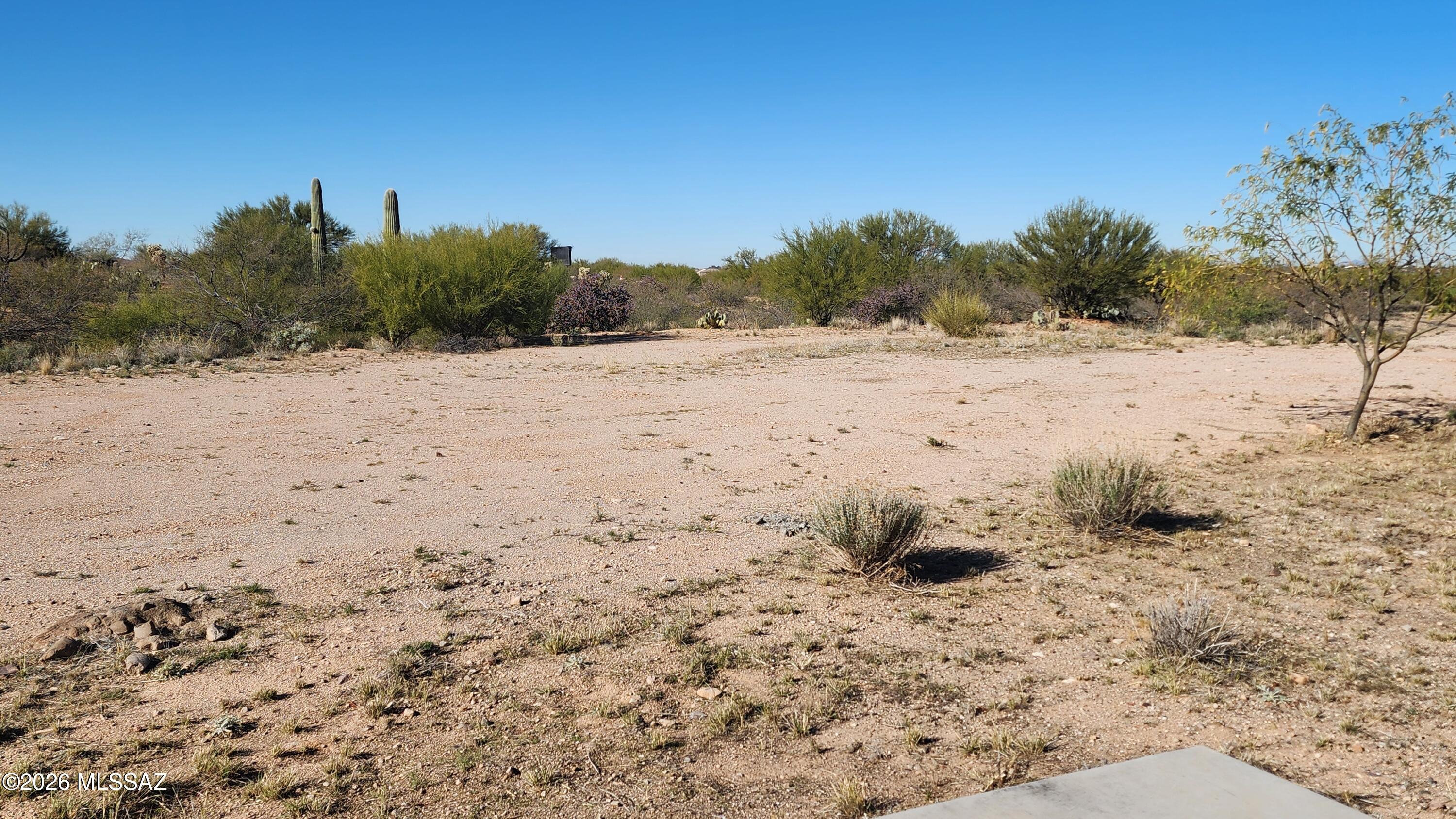 This is one of the largest lots in this 55+ community.  All utilities at the lot line and the driveway is already installed.   Level and ready to go.  Public Report available.  This community is loaded with amenities and activities.