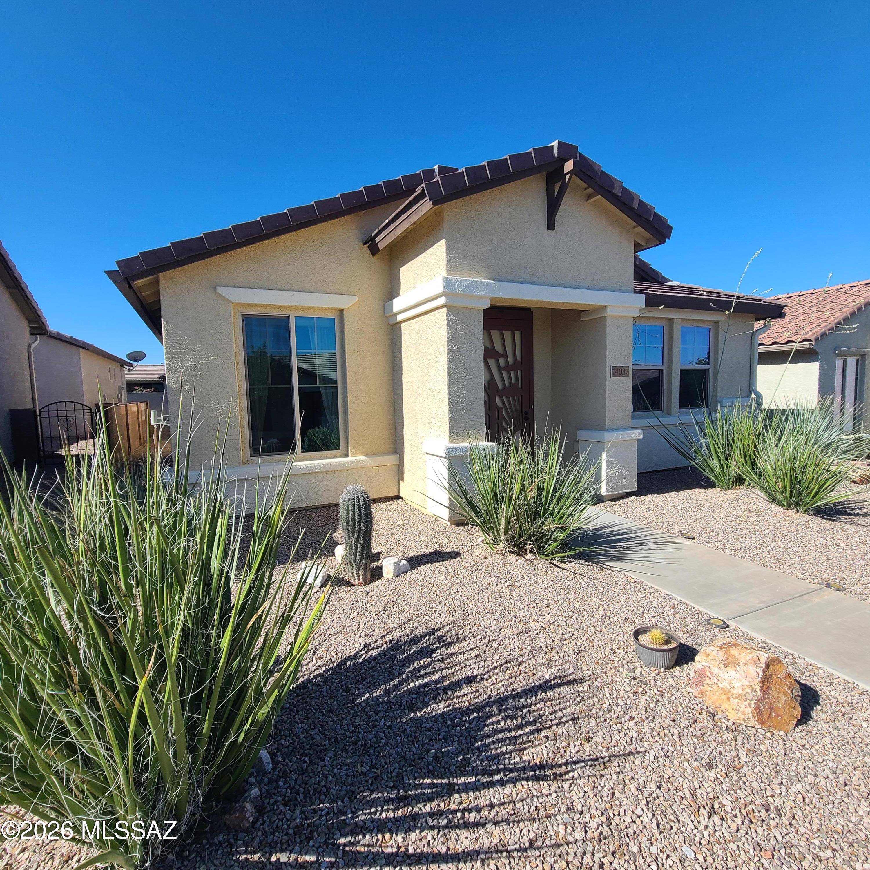 Impeccably maintained 2 bedroom, 2 bath home in Del Webb's popular Rancho Del Lago 55+ Active Community.  Floor plan features an open layout, spacious kitchen with large island & breakfast bar, & expansive windows welcoming natural light.  The private side courtyard offers a serene space for relaxing or entertaining.  Primary suite boasts a walk-in shower with bench, grab bar & oversized walk in closet.  High ceilings, recessed lighting & 2 car garage plus ample guest parking.  Close to Clubhouse with pool, spa , tennis, fitness, putting green, pickleball & more.
