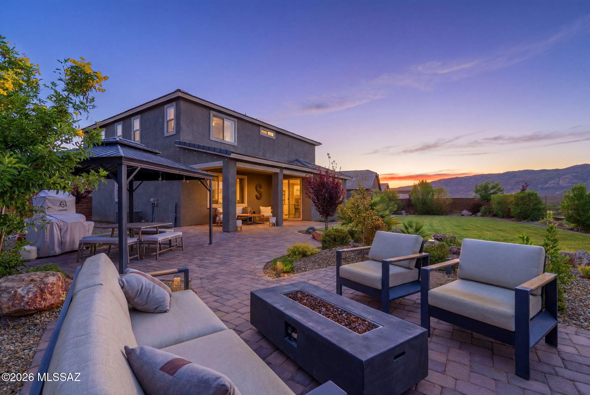 Welcome home to this 2023 contemporary residence, perfectly situated on a ridgetop lot with mountain views and nearly a quarter acre of space to enjoy. Offering 3,074 square feet, this thoughtfully designed two-story home features 4 bedrooms, 3.5 bathrooms, a large office/ den or game room, and an expansive upstairs loft living area. The open-concept layout is filled with natural light and showcases quartz countertops, stainless steel appliances, and flexible living spaces. Step outside to enjoy a beautiful above-ground pool and covered gazebo, perfect for relaxing and entertaining. A spacious 3-car garage offers ample storage, while the modern exterior and flat tile roof add curb appeal. Conveniently located near parks, trails, shopping, dining, and outdoor recreation.