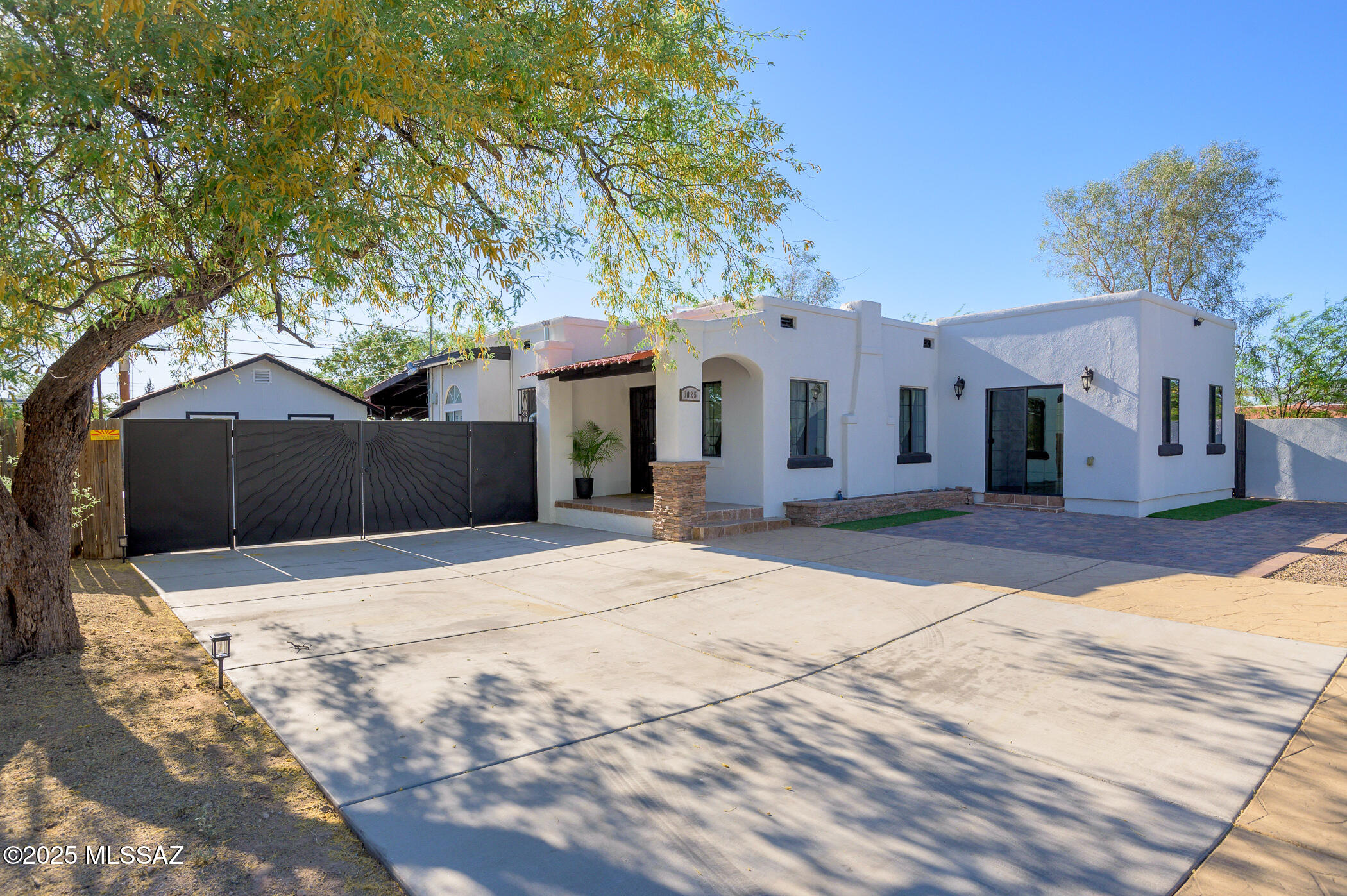 Welcome to this beautifully maintained home just minutes from Downtown  and the UofA. This 3-bedroom, 2-bath residence has been thoughtfully upgraded and cared for, showcasing the pride of ownership throughout. The spacious primary suite includes a walk-in closet, while the second large bedroom also features its own walk-in closet. A third bedroom provides plenty of space for guests or a home office. A detached flex room equipped with a mini-split offers endless possibilities, ideal for a guest suite, gym, or creative workspace. The backyard has been designed for comfort and easy entertaining, with updated landscaping and plenty of room to relax. Fresh exterior paint enhances the home's curb appeal, making it truly move-in ready. Perfectly situated in a quiet neighborhood.