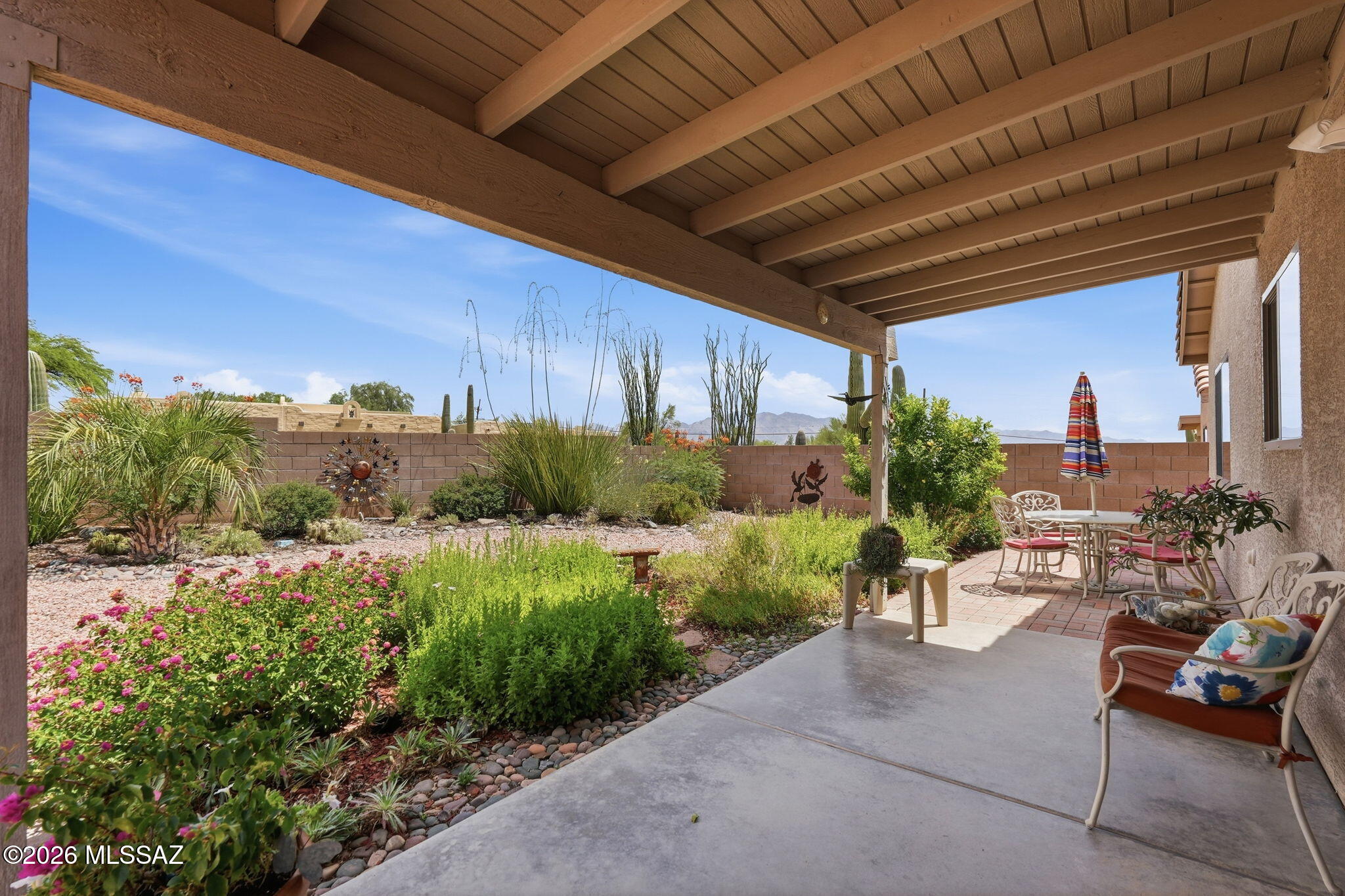 Welcome to this well maintained 4-bedroom, 2-bath home in the desirable Colina de Oro on Tucson's west side. The open floor plan features soaring ceilings, lots of natural light, tile flooring throughout the main living areas, and carpet in the bedrooms. Updated with new countertops, plenty of space and a pantry. The desirable split-bedroom floor plan offers added privacy, with a spacious primary suite featuring a large walk-in closet, dual vanities, and an updated walk-in shower. The hall bathroom has also been tastefully updated. 
Take in the mountain views from your private backyard, extended covered patio, beautiful landscaping that attracts butterflies and birds. HVAC replaced 8/2019, New Slider and windows in living room.
