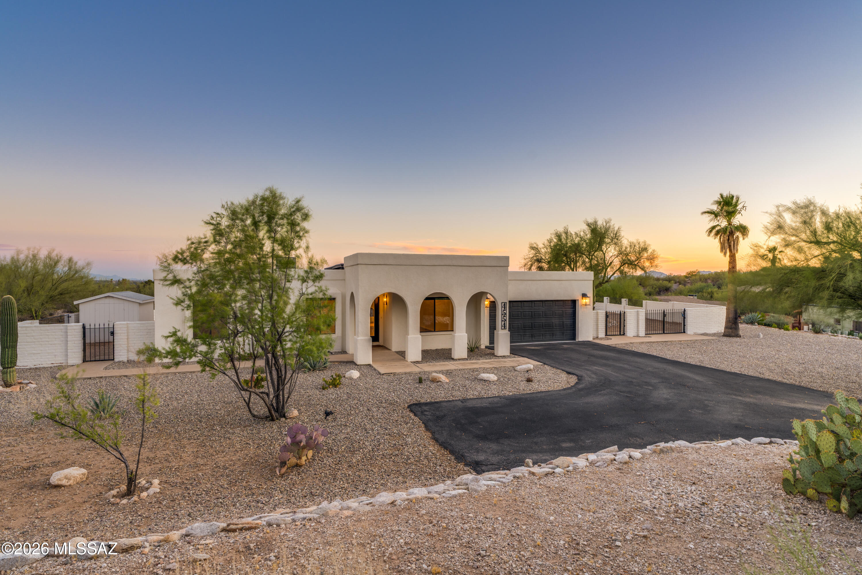 Incredible location with breathtaking mountain, city light, stargazing, and sunset views! Welcome to this spacious Foothills brick and masonry stucco home nestled in one of Tucson's most sought-after locations -- with no HOA. This beautifully remodeled residence offers a generous 2,444 sq ft floorplan featuring four bedrooms and two and a half bathrooms, including a spacious laundry/mudroom. The primary ensuite is a true retreat, complete with a walk-in closet, an upgraded bathroom, and a deep soaking tub perfect for unwinding after a long day. Newly refreshed landscaping frames the home beautifully, while the interior showcases decorative beam ceilings, custom lighting, a cozy fireplace, professional plank flooring, and dual-pane windows. -->more The chef's kitchen is thoughtfully designed for both everyday functionality and effortless entertaining. Step outside to a relaxing, resort-style hot tub with a new cover, set on a sprawling 3/4+ acre lot. The large entertainment patio, fully walled yard, and custom pavers create an ideal space for hosting or unwinding, while the double swing gate provides convenient backyard access. Natural desert space between neighbors offers a wonderful sense of privacy and tranquility. The oversized two-car garage features epoxy floors with ample storage, plus additional space for an RV or hobby vehicles -- offering exceptional flexibility for any lifestyle. Ideally located near world-class outdoor recreation, including Sabino Canyon, the famous Tucson Loop river path, parks, golf courses, and hiking and biking trails. Everyday conveniences are just minutes away, including Whole Foods, Costco, fine dining, private schools, and top healthcare facilities.
This move-in ready home truly has it all -- spectacular views, abundant amenities, and versatile spaces for relaxation and entertaining. Now all it needs is you! See the property website for full media viewing. https://media.hausphotoco.com/sites/rmojxabz/unbranded