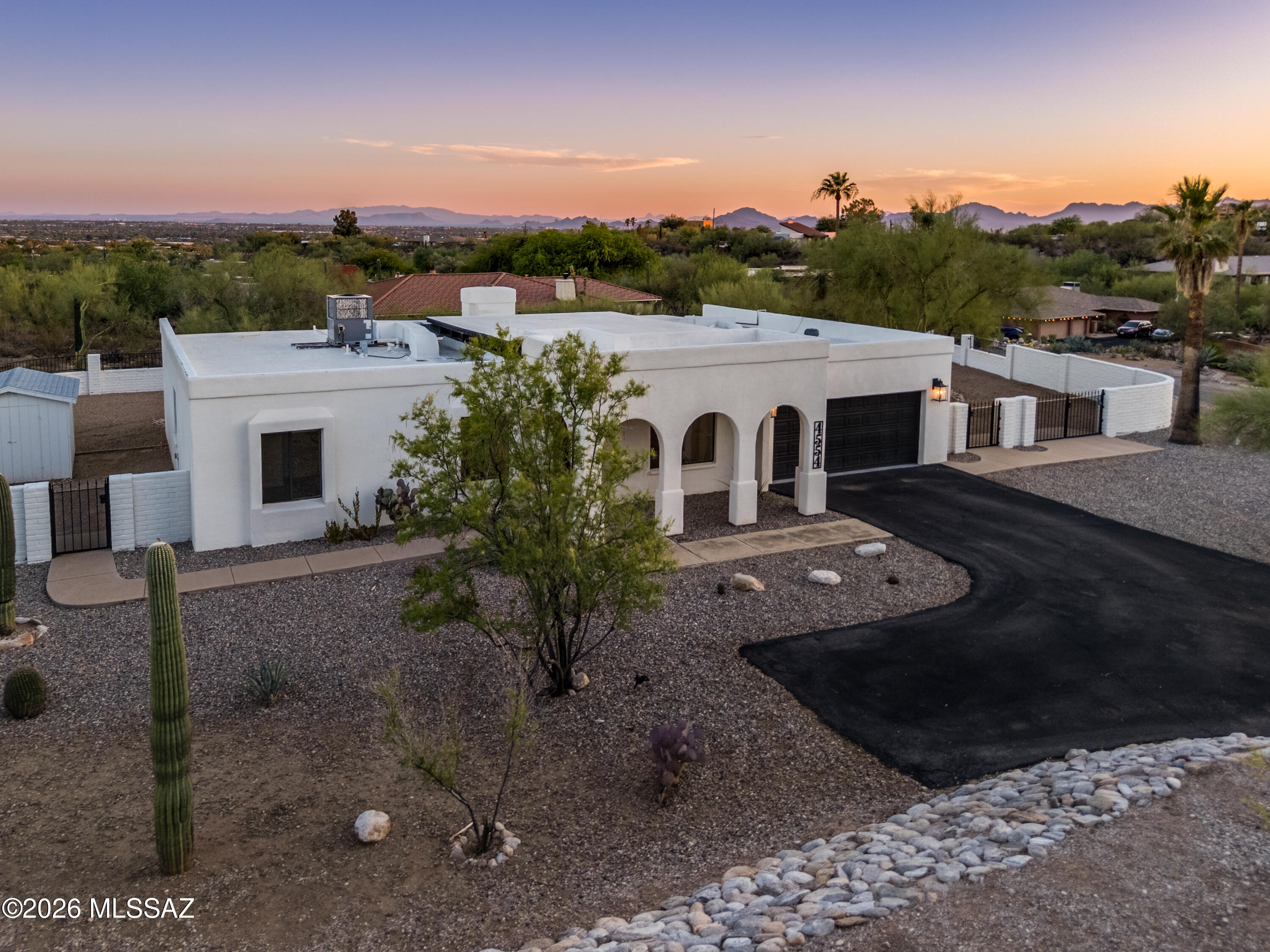 Incredible location with breathtaking mountain, city light, stargazing, and sunset views! Welcome to this spacious Foothills brick and masonry stucco home nestled in one of Tucson's most sought-after locations -- with no HOA. This beautifully remodeled residence offers a generous 2,444 sq ft floorplan featuring four bedrooms and two and a half bathrooms, including a spacious laundry/mudroom. The primary ensuite is a true retreat, complete with a walk-in closet, an upgraded bathroom, and a deep soaking tub perfect for unwinding after a long day. Newly refreshed landscaping frames the home beautifully, while the interior showcases decorative beam ceilings, custom lighting, a cozy fireplace, professional plank flooring, and dual-pane windows. -->more The chef's kitchen is thoughtfully designed for both everyday functionality and effortless entertaining. Step outside to a relaxing, resort-style hot tub with a new cover, set on a sprawling 3/4+ acre lot. The large entertainment patio, fully walled yard, and custom pavers create an ideal space for hosting or unwinding, while the double swing gate provides convenient backyard access. Natural desert space between neighbors offers a wonderful sense of privacy and tranquility. The oversized two-car garage features epoxy floors with ample storage, plus additional space for an RV or hobby vehicles -- offering exceptional flexibility for any lifestyle. Ideally located near world-class outdoor recreation, including Sabino Canyon, the famous Tucson Loop river path, parks, golf courses, and hiking and biking trails. Everyday conveniences are just minutes away, including Whole Foods, Costco, fine dining, private schools, and top healthcare facilities.
This move-in ready home truly has it all -- spectacular views, abundant amenities, and versatile spaces for relaxation and entertaining. Now all it needs is you!