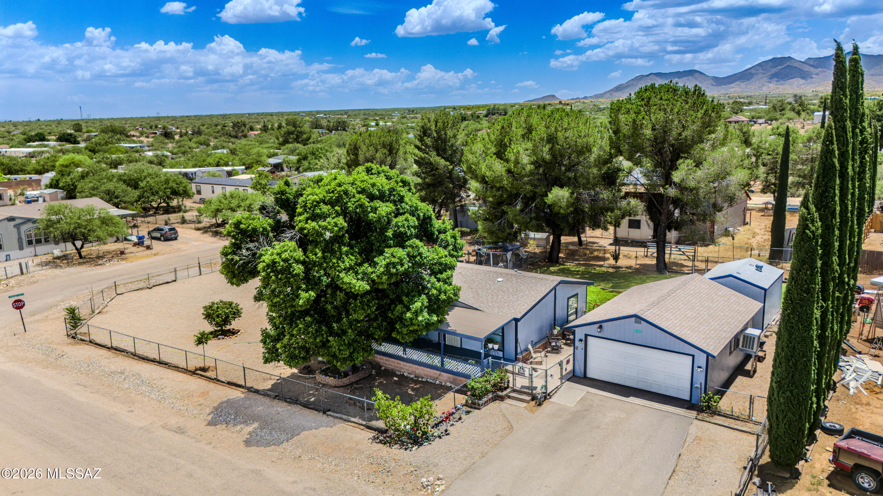 This well-maintained 1,568 sq. ft. home sits on a fully fenced double lot offering space, privacy, and versatility. Enjoy a lush backyard with mature shade trees--your own desert retreat. A new 10' x 15' shed with loft plus an additional shed provide ample storage or workspace. Detached 2-car garage includes workbenches.
Inside features an open split-bedroom floor plan, new laminate flooring with warranty, ceiling fans throughout, and an updated kitchen with knotty pine cabinets, soft-close drawers, and pull-outs. New water heater and 4-year-old roof add peace of mind.