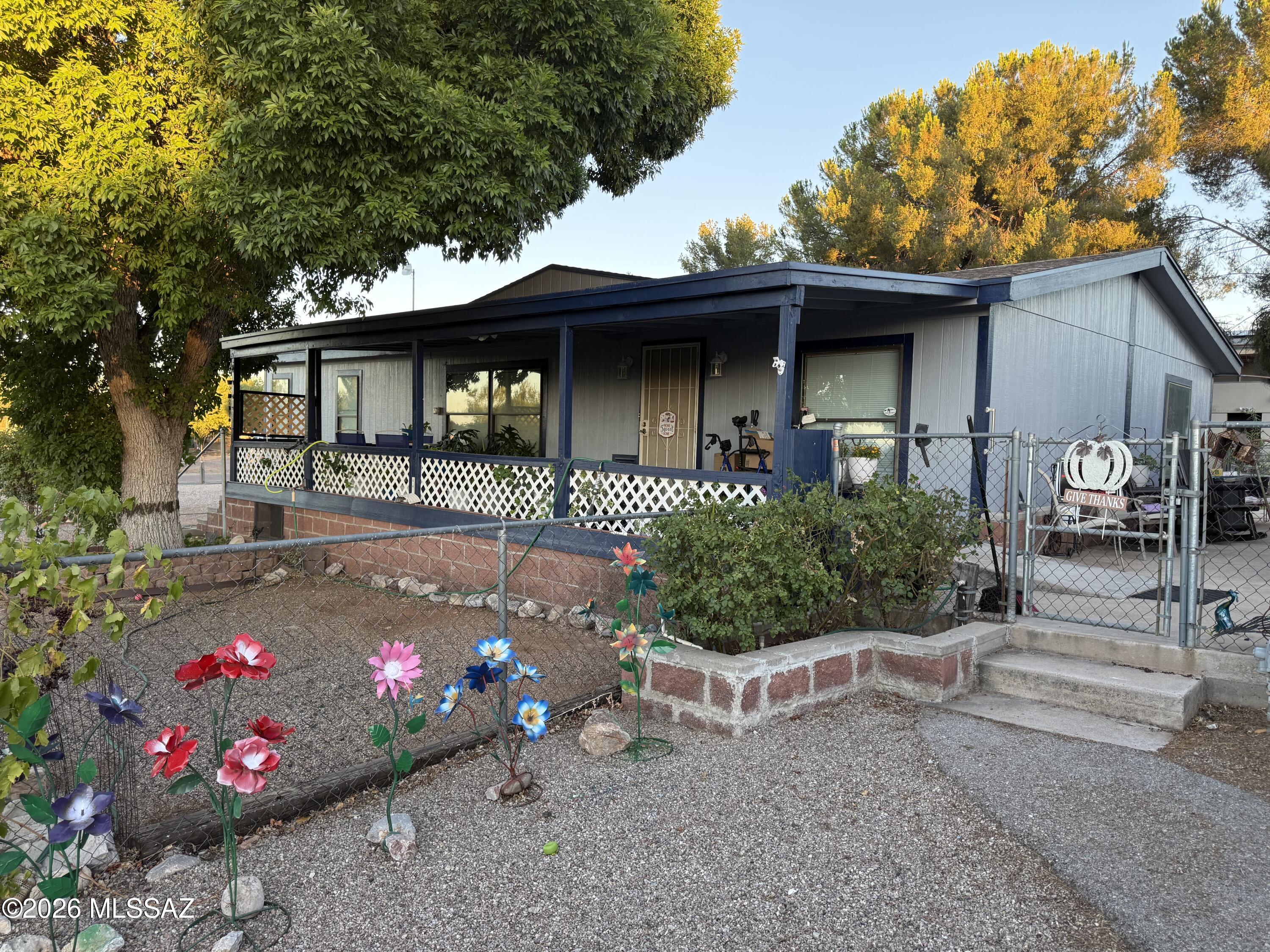 This well-maintained 1,568 sq. ft. home sits on a fully fenced double lot offering space, privacy, and versatility. Enjoy a lush backyard with mature shade trees--your own desert retreat. A new 10' x 15' shed with loft plus an additional shed provide ample storage or workspace. Detached 2-car garage includes workbenches.
Inside features an open split-bedroom floor plan, new laminate flooring with warranty, ceiling fans throughout, and an updated kitchen with knotty pine cabinets, soft-close drawers, and pull-outs. New water heater and 4-year-old roof add peace of mind.