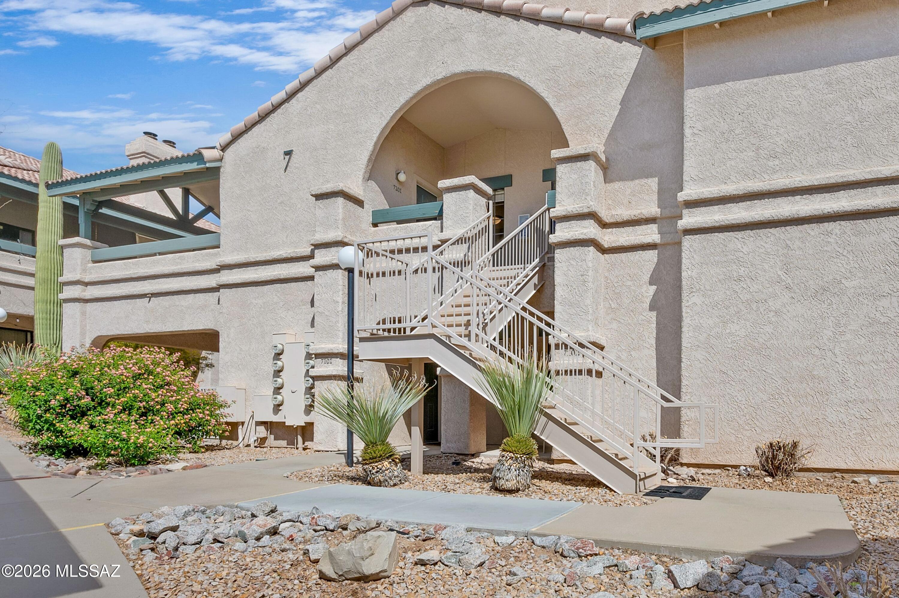 Experience effortless resort-style living in this beautifully updated 2-bedroom, 2-bath condominium at Moonrise at Starr Pass. This upper level unit offers higher ceilings and additional safety from the 2nd floor balcony. Perfectly positioned adjacent to the renowned Starr Pass Golf Club and surrounded by scenic walking and hiking trails, this community offers an exceptional lifestyle with amenities including a pool and spa, tennis courts, fitness center, and clubhouse.

Unit 7201 is truly turnkey, with an extensive list of thoughtful upgrades that elevate both comfort and functionality. The interior features updated flooring, fresh paint, new carpet, and a fully refreshed kitchen with newer appliances and undercabinet lighting.

(Continued in Supplement Remarks) Both bathrooms have been tastefully enhanced with new vanities, mirrors, fixtures, toilets, and resurfaced shower and tub. Major systems have also been addressed, including a 3-year-old HVAC system, a newer water heater with a pressure tank, and updated plumbing with new valves and a dedicated main water shutoff to the unit. Additional improvements include replaced electrical receptacles and switches, newer window coverings, and resurfaced patio floors. The spacious great room seamlessly integrates living and dining areas, anchored by a cozy fireplace--ideal for both relaxing and entertaining. A dedicated covered parking space adds convenience, while the surrounding natural desert landscape and resort amenities create a lock-and-leave opportunity or full-time residence with minimal maintenance. A rare opportunity to own a meticulously upgraded condo in one of Tucson's premier resort communities.