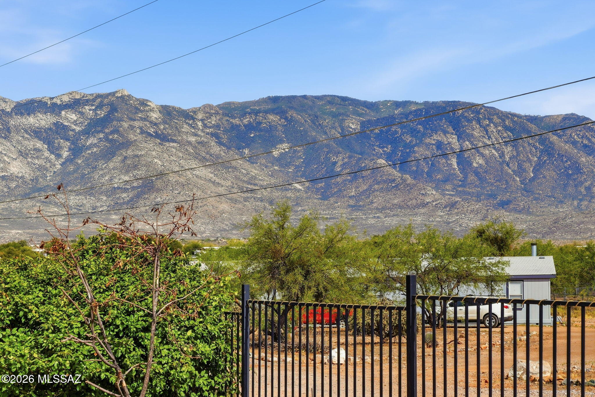 Two 1900+ Sq ft manufactured homes with workshop! One home is 4 bdrms one home is a 3bdrm 2 bath. Great opportunity to live in one home and rent the other. Enjoy the beautiful Catalina Mountain views and the quiet environment. The 2 homes on 1 acre are settled on a cul-de-sac off of a paved road. Municipal water company. Fully fenced yard and room for horses or toys! No HOA.