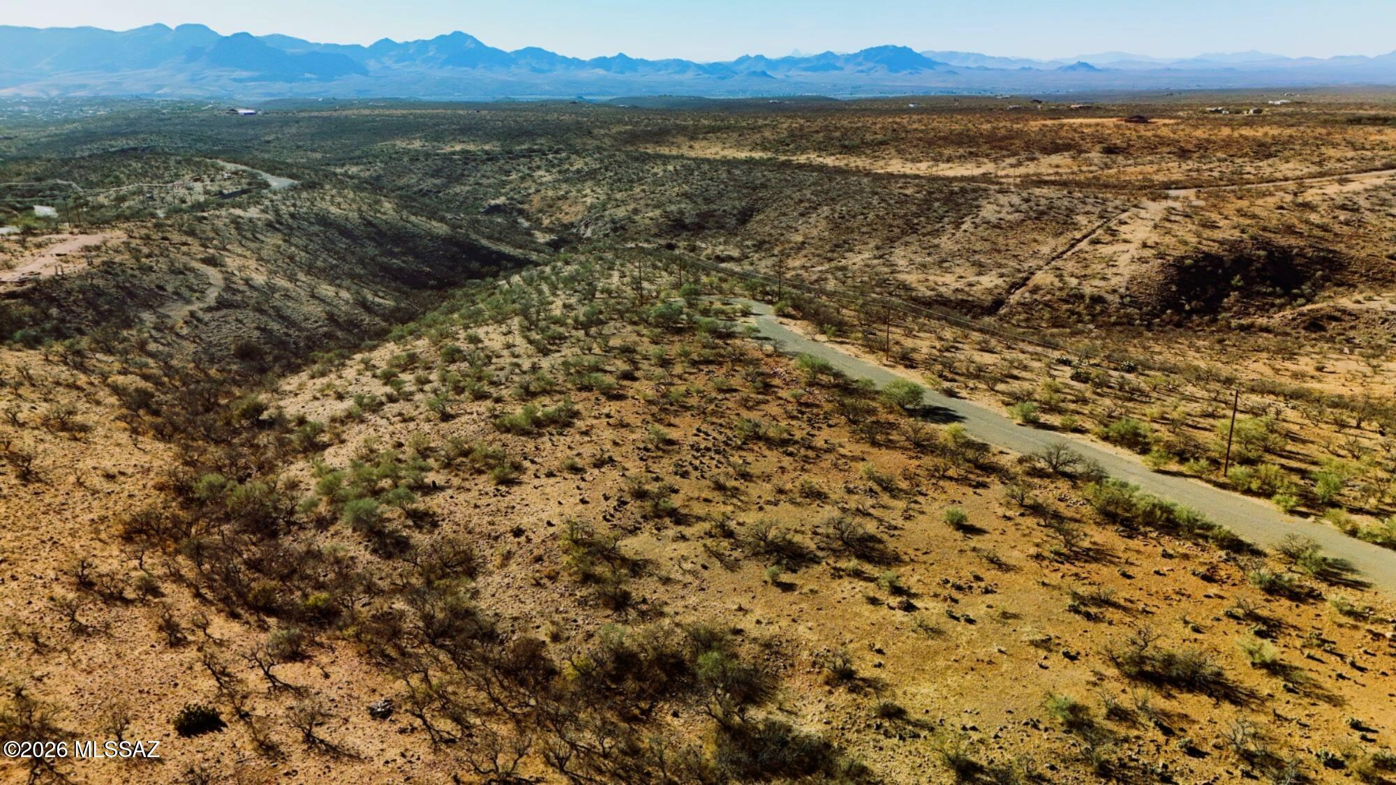 Far NE Rio Rico, Santa Cruz county vacant land lot, 0.46 acres. Subdivided, wide open mountain views, investment opportunity. Undeveloped area currently, buyers to confirm utility. Santa Cruz county building code for SCC-R-4, No HOA, no CC&Rs.
