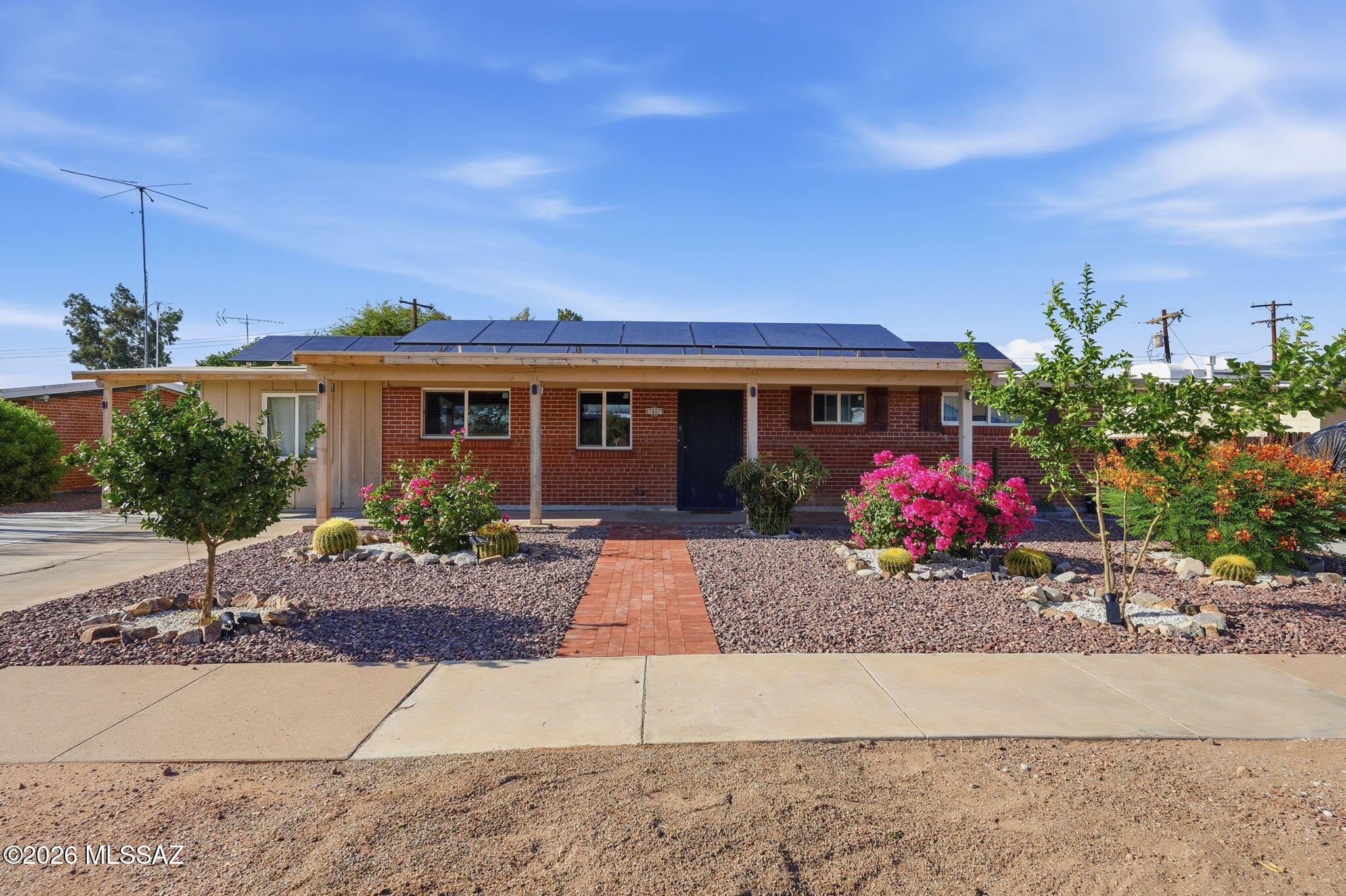 Well-maintained 3-bedroom, 2-bath home offering approximately 1,780 sq. ft. with no HOA and paid-off solar. The spacious open-concept living and dining area is complemented by granite countertops and a versatile bonus room ideal for a home office, hobby room, or additional flex space. Situated on a generously sized lot with a covered patio, concrete slab, rolling rear gate, and ample parking for vehicles, trailers, or toys. Conveniently located on Tucson's east side near shopping, dining, parks, and schools. Competitively priced and ready for its next owner. Don't miss this opportunity!