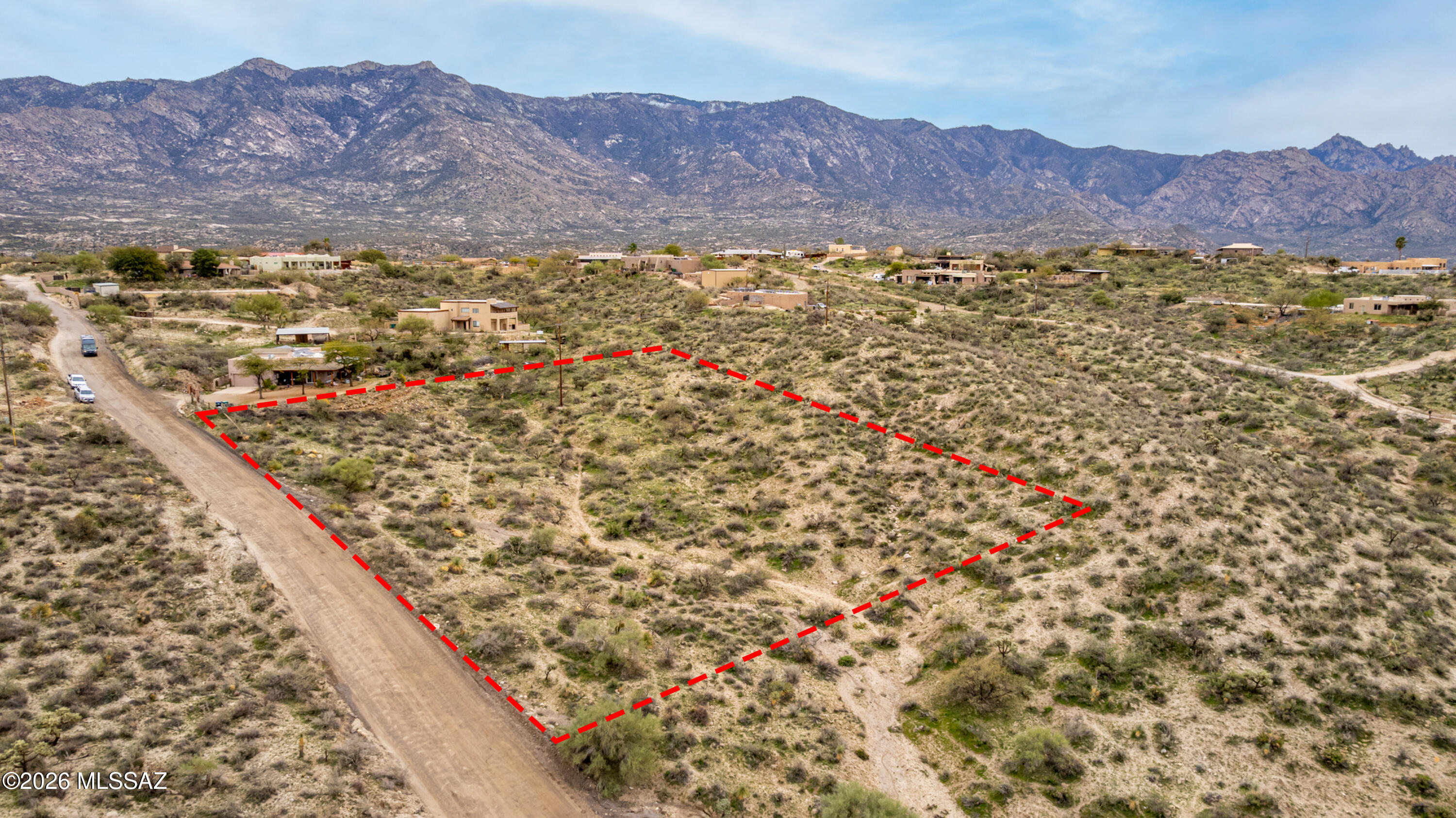 2.66-acre custom homesite with sweeping Catalina and Tortolita Mountain views, city lights, and no HOA--just minutes from town. Ideal for a site-built custom home with utilities at the lot line and flexible build positioning.

The property features natural desert terrain with multiple potential build envelope options to maximize views and privacy. A wash traverses the parcel and will require engineered driveway planning (culvert or similar crossing) depending on final home placement. Estimated excavation for a custom home pad is approximately $6,000.

Zoning supports site-built homes (minimum approx. 1,500 sq ft). Manufactured homes, commercial uses, and garage-first builds are not permitted. Located on Cloud Nine Drive in Sutherland Heights, with close proximity to Coronado National Forest and access to hiking, biking, and equestrian trails.

Ideal for a buyer or builder seeking a clearly defined custom home opportunity with strong views, privacy, and realistic, manageable site considerations.
