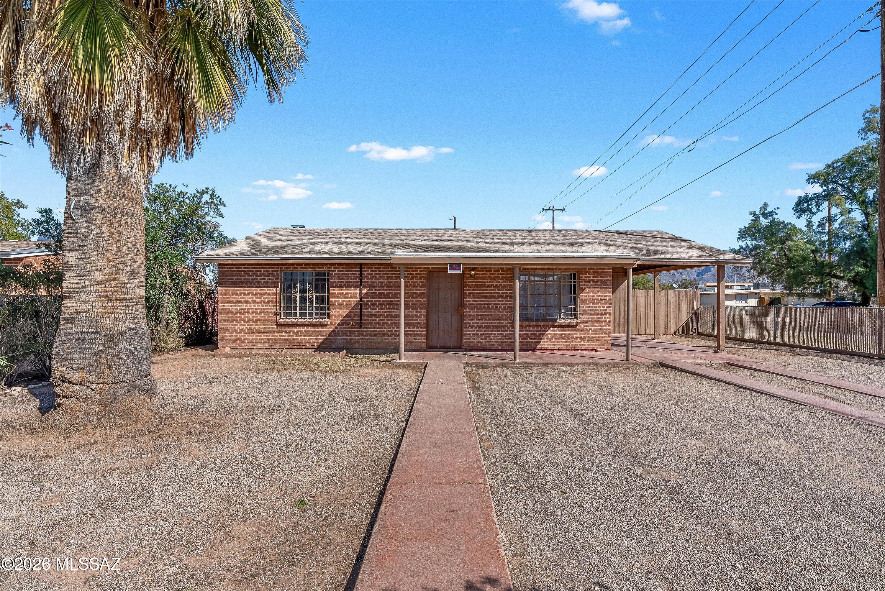 Charming brick home with great curb appeal on a generously sized R-2 zoned lot in central Tucson. Close to the U of A with easy access to the Mountain Ave. Bike Path, Sun Tran bus routes, and downtown Tucson. Functional floor plan features large ceramic tile throughout and premium laminate wood-grain flooring in both bedrooms. Spacious storage closet in the carport. Oversized north-facing backyard showcases gorgeous mountain views, while the expansive covered patio offers abundant space and shade for relaxing, entertaining, or future expansion with a guest house or pool. Excellent opportunity for first-time buyers, investors, or anyone seeking flexibility and potential in a prime location. MOTIVATED SELLER.