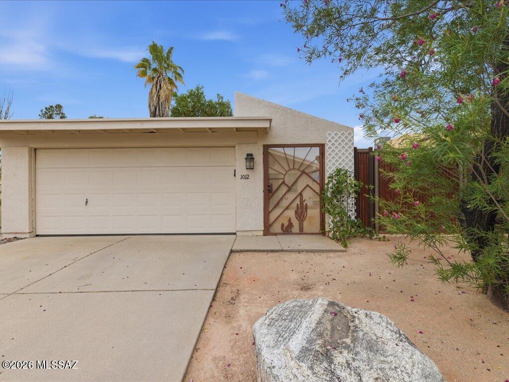 Tucked away in a quiet cul-de-sac on Tucson's desirable far northeast side, this charming home offers the perfect blend of comfort, privacy, and scenic desert living. Featuring 2 spacious bedrms, 2 full baths, and a versatile den/office space, this home is designed for both relaxation and functionality. Step inside to high vaulted ceilings that create an open, airy feel throughout the living spaces, while natural light highlights the home's inviting layout. Enjoy the convenience of a separate garage space, providing added storage and privacy, RV gate for easy access,  along with an oversized backyard overlooking a peaceful pond and Catalina Mtn views.
NO HOA Whether you're working from home, entertaining guests, or simply enjoying Tucson sunsets, this hidden gem delivers tranquility while still being close to everything.
