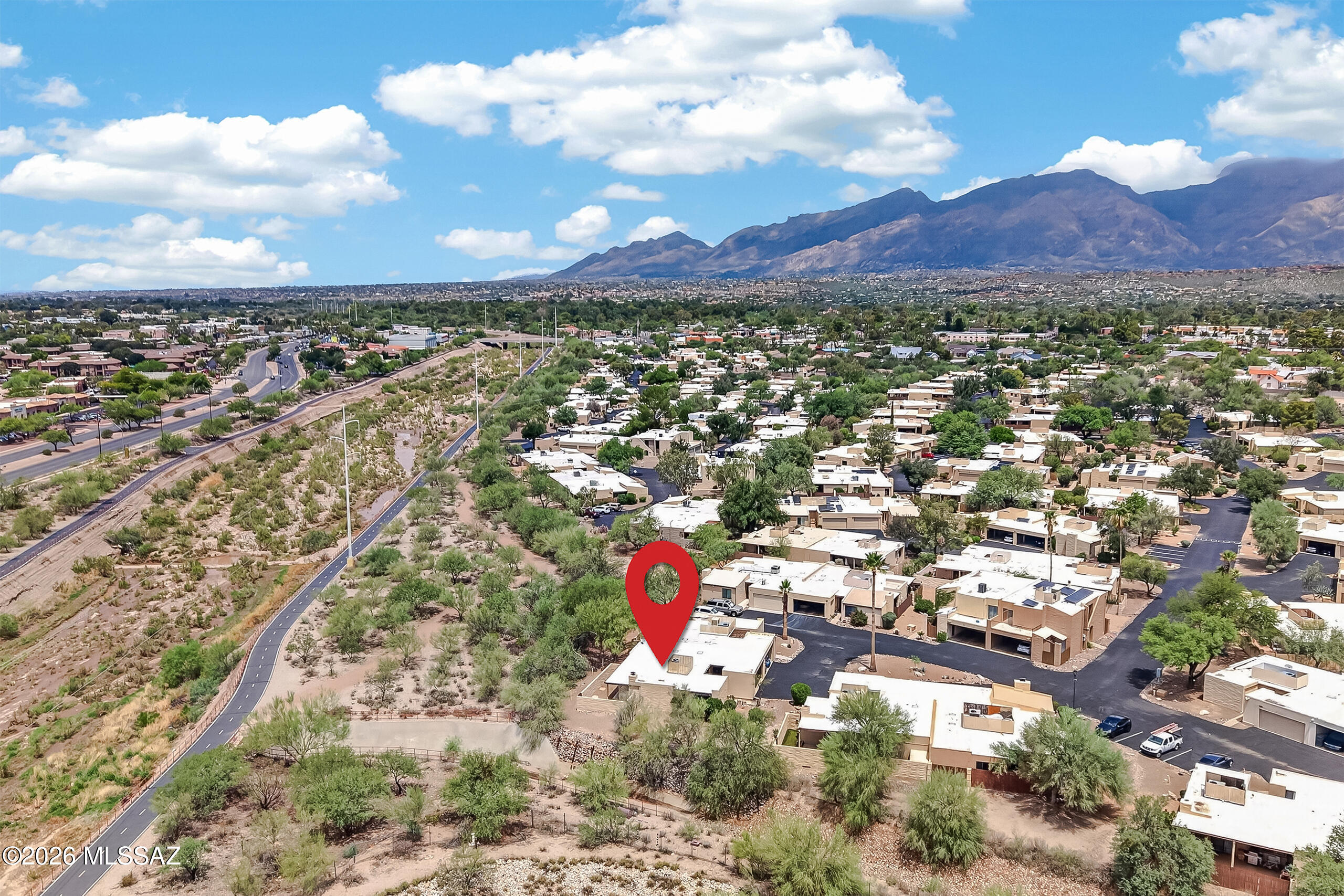 This charming end-unit townhome offers one of the best locations in the community, with added privacy, a spacious side yard, and easy access to the community pool and clubhouse. The bright, open living area features a classic beehive fireplace, while the kitchen includes a pantry, stainless steel slide-in range, and stainless-steel dishwasher.
The remodeled bathroom features a walk-in shower with tile extending to the ceiling, a new vanity, toilet, framed mirror, updated lighting, and tile flooring. Outside, you'll enjoy a private walled backyard with an oversized covered patio and brick paver walkway--an ideal space to relax or entertain.
Additional features include a two-car covered carport with storage, a dedicated laundry room, and a HVAC system installed in 2019.
Conveniently locat near the Pantano Wash section of Tucson's 130-mile Chuck Huckelberry Loop, you'll have miles of walking and biking trails just moments away. Udall Park, shopping, restaurants, and everyday conveniences are all close by, making this an excellent eastside location.