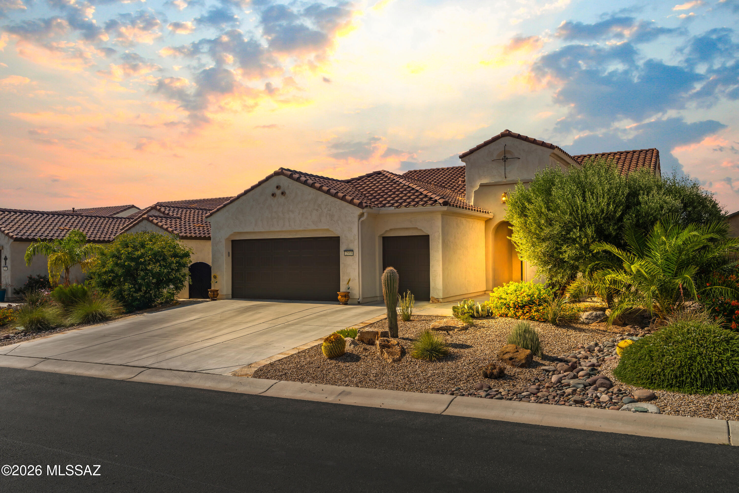 The beautiful travertine pavers and cozy front porch will greet you at this lovingly maintained home in the prestigious Robson community of Quail Creek. The open floor plan offers a spacious living room with a built-in cabinet and a dining area featuring a built-in buffet. The kitchen boasts granite countertops, an island and a generous pantry, perfect for everyday living and entertaining. Enjoy 2 bedrooms, 2½ baths, including quartz countertops in 2 bathrooms. The den/office is conveniently located near the front entry. Relax outdoors on the covered patio with travertine pavers. A 2½-car garage provides space for two vehicles, a golf cart, as well as a workbench and overhead storage. This thoughtfully designed home blends comfort, style, and convenience in an exceptional setting.