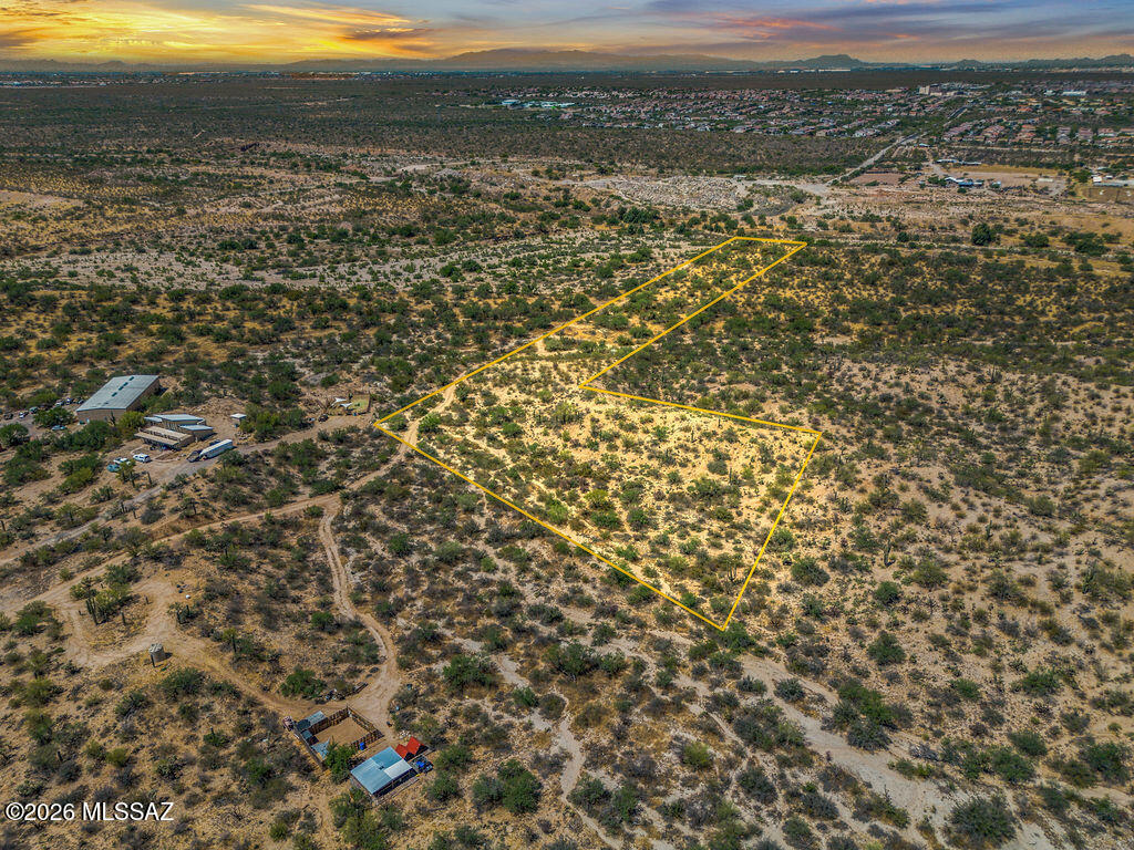 In Tucson's desirable southeast corridor sits 5.38 acres of Sonoran Desert beauty along the iconic Old Spanish Trail.  Bordering a scenic riparian area, this unique parcel offers privacy, wildlife, and wide-open desert views with usable buildable space outside the flood zone.  This amazing parcel Features a mix of flat, rolling, and gently sloped terrain, the property is ideal for a custom home, horse property, desert retreat, or long-term investment. The irregular shape adds character and flexibility for creative site design and elevated view opportunities.  Located in the acclaimed Vail Unified School District with easy access to Tucson, I-10, shopping, and recreation.  The possibilities are endless when you sculpt the perfect home or golf course.   Yes, zoned for a golf course too. work is done, and all you need to do is design your dream ranch!   Buyer to verify floodplain, utilities, zoning, and development feasibility during inspection period.