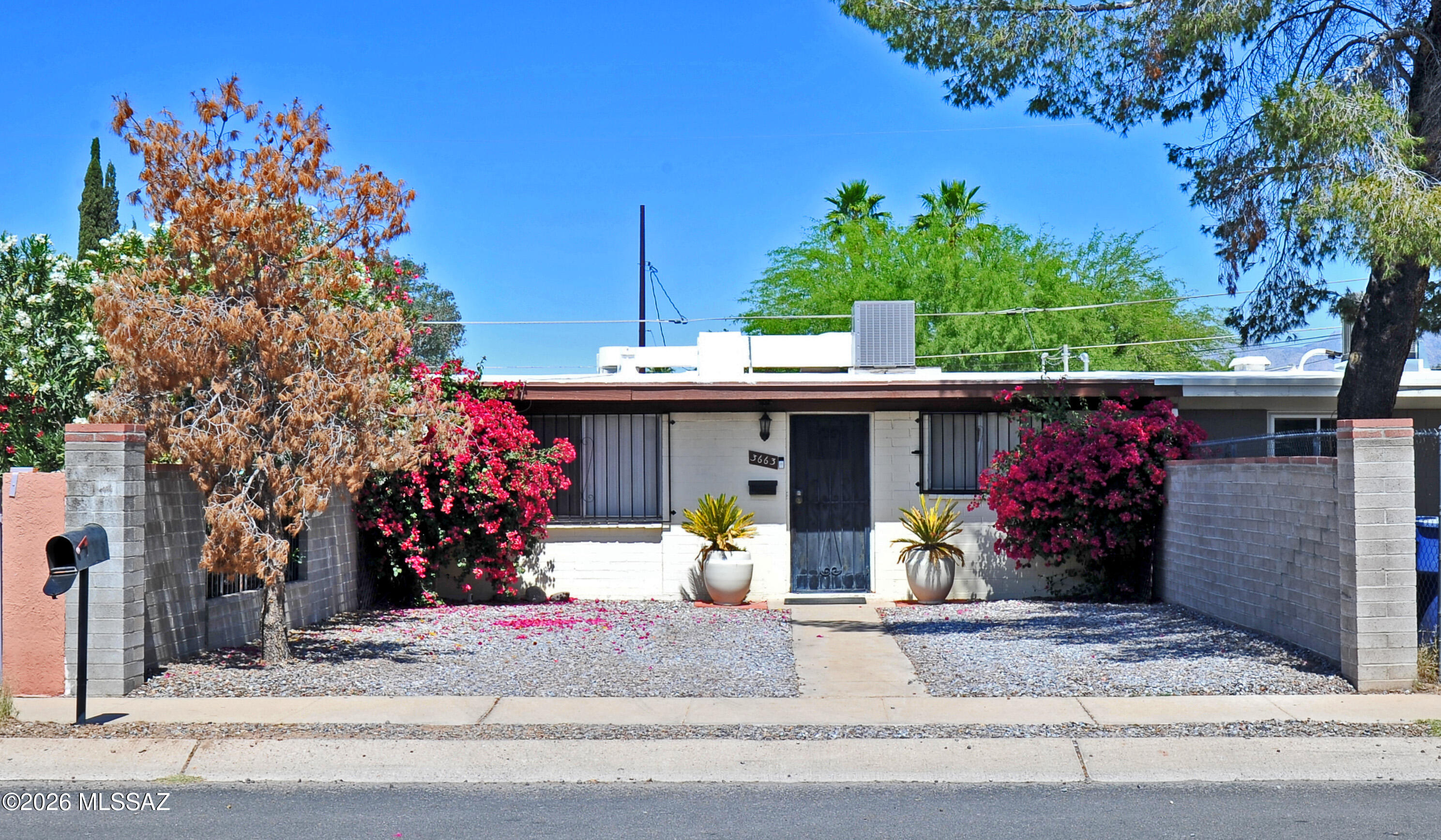 Turn-key and income-ready, this charming 2-bedroom, 1-bath central Tucson home is currently operating as a successful Airbnb and can be sold furnished for a seamless investment or move-in opportunity. Inside, you'll find a comfortable, well-maintained layout with an enclosed patio/bonus room off the laundry area, ideal as an office, studio, or small flex space. The backyard is designed for relaxation and low-maintenance enjoyment, featuring a turf grass area perfect for outdoor lounging and a large storage shed for added convenience. Centrally located near shopping, Reid Park, and bus lines, this property offers easy access to everyday amenities while appealing to both homeowners and short-term rental guests alike. DON'T FORGET TO CHECK OUT THE NEIGHBORHOOD URBAN FARM ON THE CORNER!