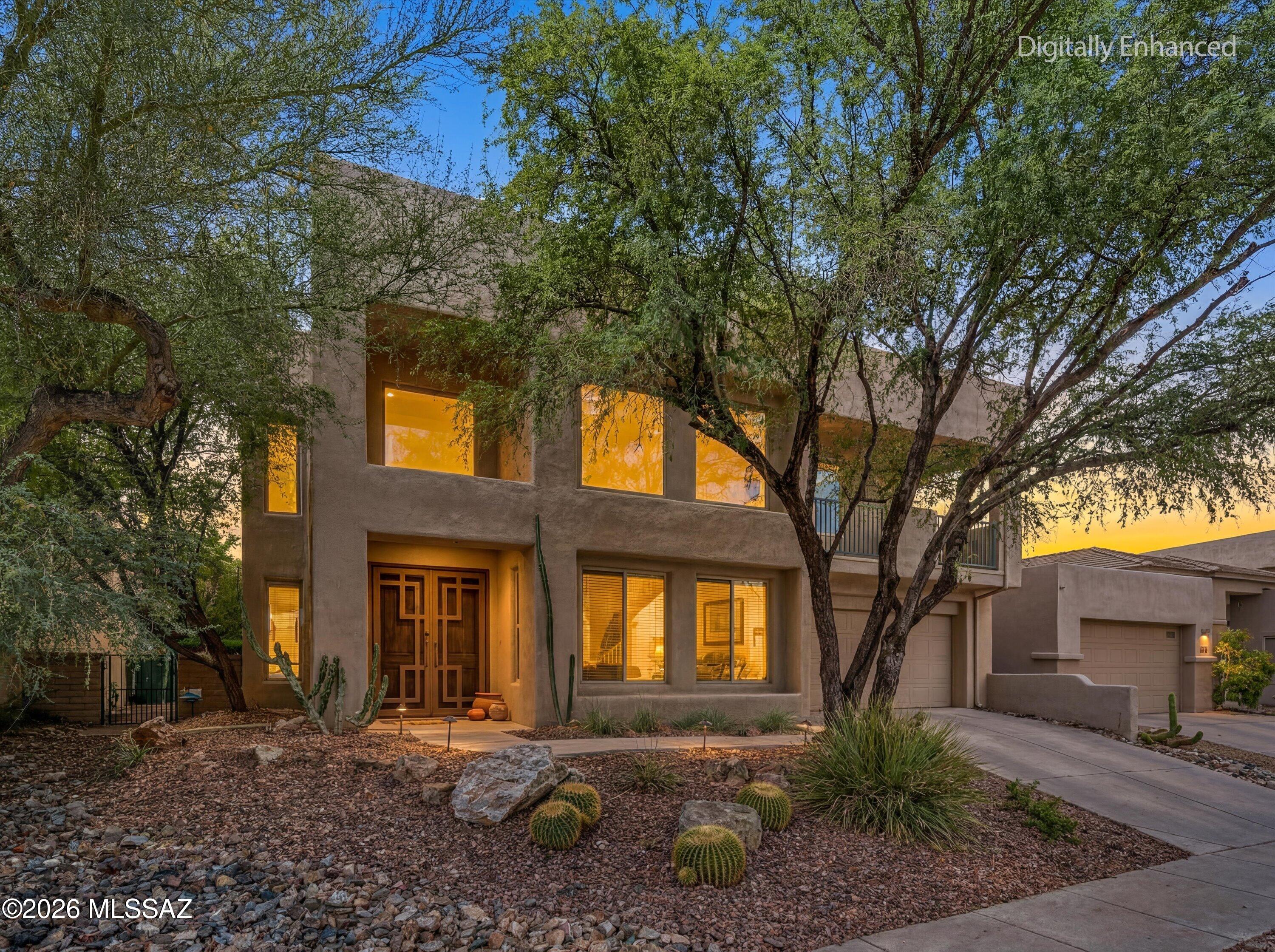 Stunning Foothills Retreat with Panoramic City & Mountain Views nestled within the gated enclave of Bonita Ridge. This
 beautifully maintained 4-bedroom, 3-bath residence offers a rare blend of privacy, elegance, and breathtaking desert scenery. Perched to capture sweeping city and mountain views, the home showcases unforgettable sunsets and sparkling city lights from its serene backyard oasis.
The light-filled interior features expansive windows that flood the home with natural light, creating a warm and inviting ambiance throughout. The tastefully updated kitchen features generous cabinetry, ample counter space, a dedicated prep area, and a breakfast bar--perfect for both everyday living and entertaining. A main-level guest bedroom and full bath provide ideal flexibility for visitors o multigenerational living. Upstairs, the spacious owner's suite is a true retreat, complete with a private balcony overlooking the valley below. Two additional bedrooms complete the upper level, including one with a Jack-and-Jill bath and another with its own private balcony. Located just minutes from trailheads, shopping, restaurants, and the natural beauty of Sabino Canyon Recreation Area. This home offers the perfect balance of convenience and tranquility.  Enjoy community luxuries including landscaped paths, a large pool, spa, and secure gated entrance. Welcome Home!