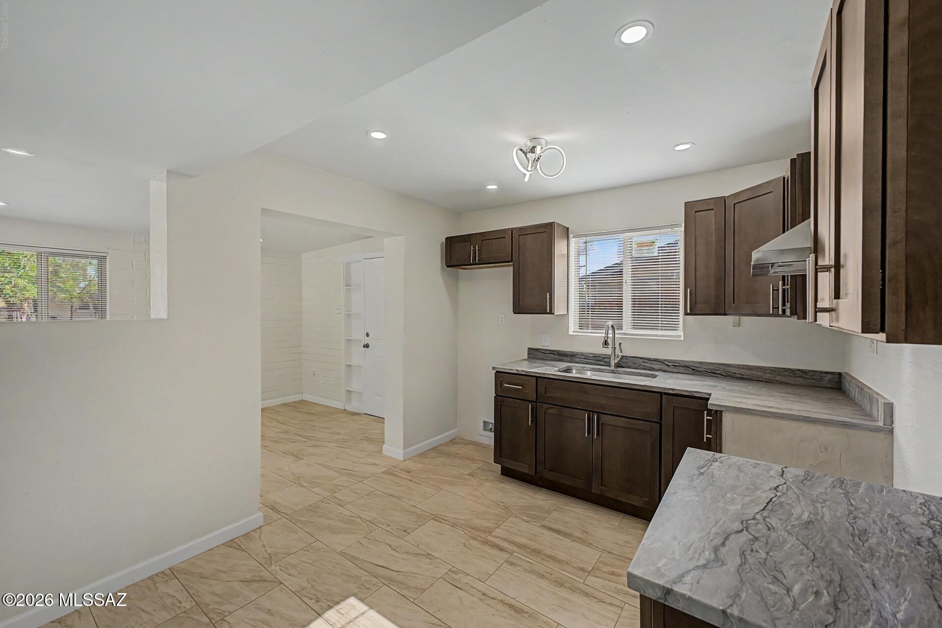 Completely Remodeled -Move-In Ready!
This charming 3-bedroom, 1-bath Territorial-style home has been thoughtfully updated from top to bottom. Major system upgrades include a brand-new roof, fully replaced sewer system and interior plumbing, updated electrical panel, new HVAC split system, and a new water heater -- giving buyers true peace of mind. Inside, you'll find new cabinets topped with quartz countertops, stainless appliances including a gas range with range hood, new double pane windows, updated outlets and light fixtures, recessed LED can lights, and fresh interior and exterior paint throughout. The home features ceramic tile and carpet flooring, a walk-in tub, laundry room, wrought iron security door, and energy-efficient lighting throughout.
Owner/Agent