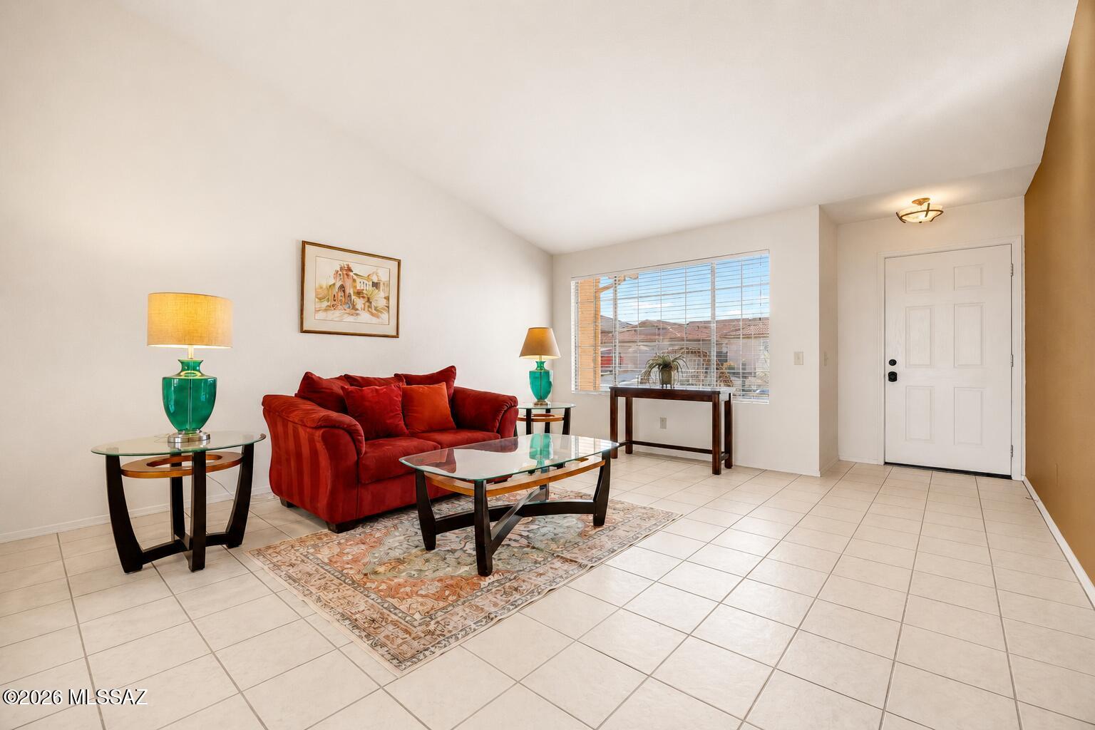 Fall in love with this darling Loma Model nestled on a quiet street with an oversized rear yard! This well-maintained home features elegant tile flooring throughout the main living areas, with cozy carpeting in the second bedroom. The spacious great room boasts vaulted ceilings and an abundance of natural light. Additional highlights include a comfortable guest room with a built-in Murphy bed, a full hall bath, and a generously sized laundry room with a utility sink and ample storage. Hot water recirculation pump and a Trane HVAC system with new compressor add to the home's comfort and efficiency. Located in SaddleBrooke, an award-winning 55+ community! Call today for a private showing!