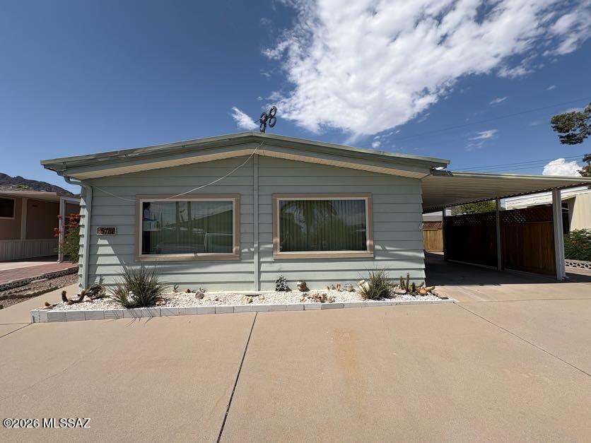 Nicely maintained ground set home close to amenities in this 55+ community! Vaulted living room ceiling. Whole house water filter system, concrete ramp to door on west side. Workshop/shed and screened room on east side along with extra paver patio area. Also on east side 
is a gated area with privacy fence for patio or golf cart storage. Laminate flooring in 
living room and bedroom, no carpet in the house. The low HOA fee includes unlimited golf, tennis, 
pickleball, shuffleboard, 3 pools, spa, exercise room, trash collection, and a lot more. Also 
included is the full use of separate buildings for card games, billiards, dances, concerts, church 
services, and other social gatherings. You own the land, no lot rent!