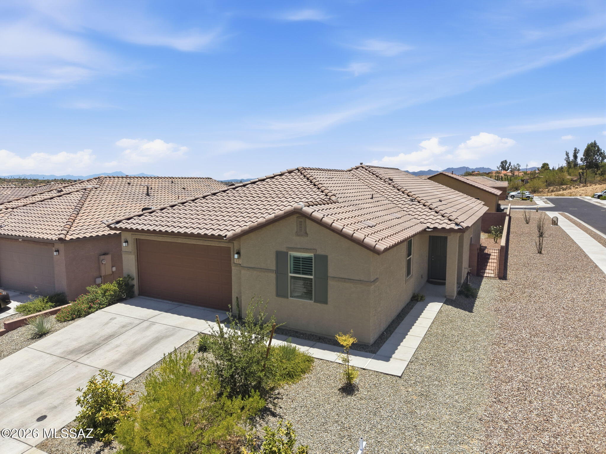 Built in 2023 and gently lived in, this beautifully maintained Vista Del Oro home offers the perfect blend of modern design and move-in-ready convenience. Situated on a desirable corner lot. This popular split-bedroom  floor plan features 3 bedrooms plus a versatile den/office, ideal for working from home or additional living space. The spacious kitchen showcases granite countertops, stainless steel appliances, a gas range, abundant cabinetry and ample workspace for everyday living and entertaining. Additional highlights include plantation shutters, tankless water heater, professionall landscaped yard and motorized patio sunshades for comfortable outdoor living, This like-new home has been meticulously cared for and is ready for its next owner to enjoy!