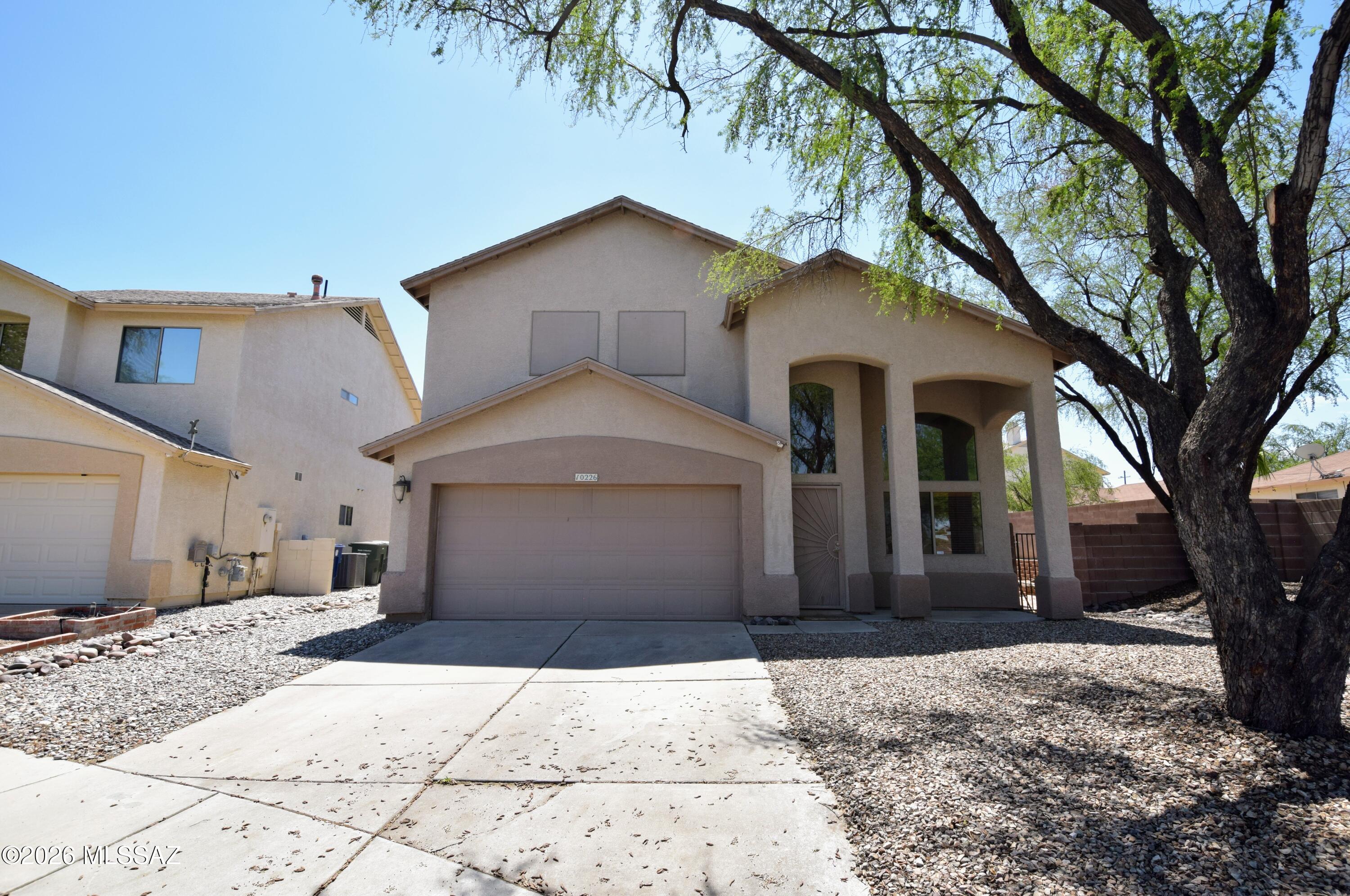 Rustic, Warm, and Clean 4 Bed 2.5 Bath in Rita Ranch ready for tenants. 2010 SQ FT with Custom Elements all over the place in this home. The main entryway has cathedral height ceilings and a stacked stone circular open-air staircase. Open Kitchen has upgraded slab granite counters, stacked stone cabinet facing, and tiled backsplash. Nothing but tile on the 1st floor. The 3-level wood floor stairway leads you right into a French Door entry of the primary suite which has a walk-in closet, custom shower, and dual sink vanity. The guest bedroom near the primary suite has custom barn doors. All 4 Bedrooms are upstairs. The gorgeous multi-tiered and private backyard has a full-length east-facing patio, tons of shade, a multi-fruit citrus tree, and lots of landscape to view. Bi-Annual Landscape work is included in the rent price. This home is offered to NON-SMOKING applicants. Pets are subject to owner approval.