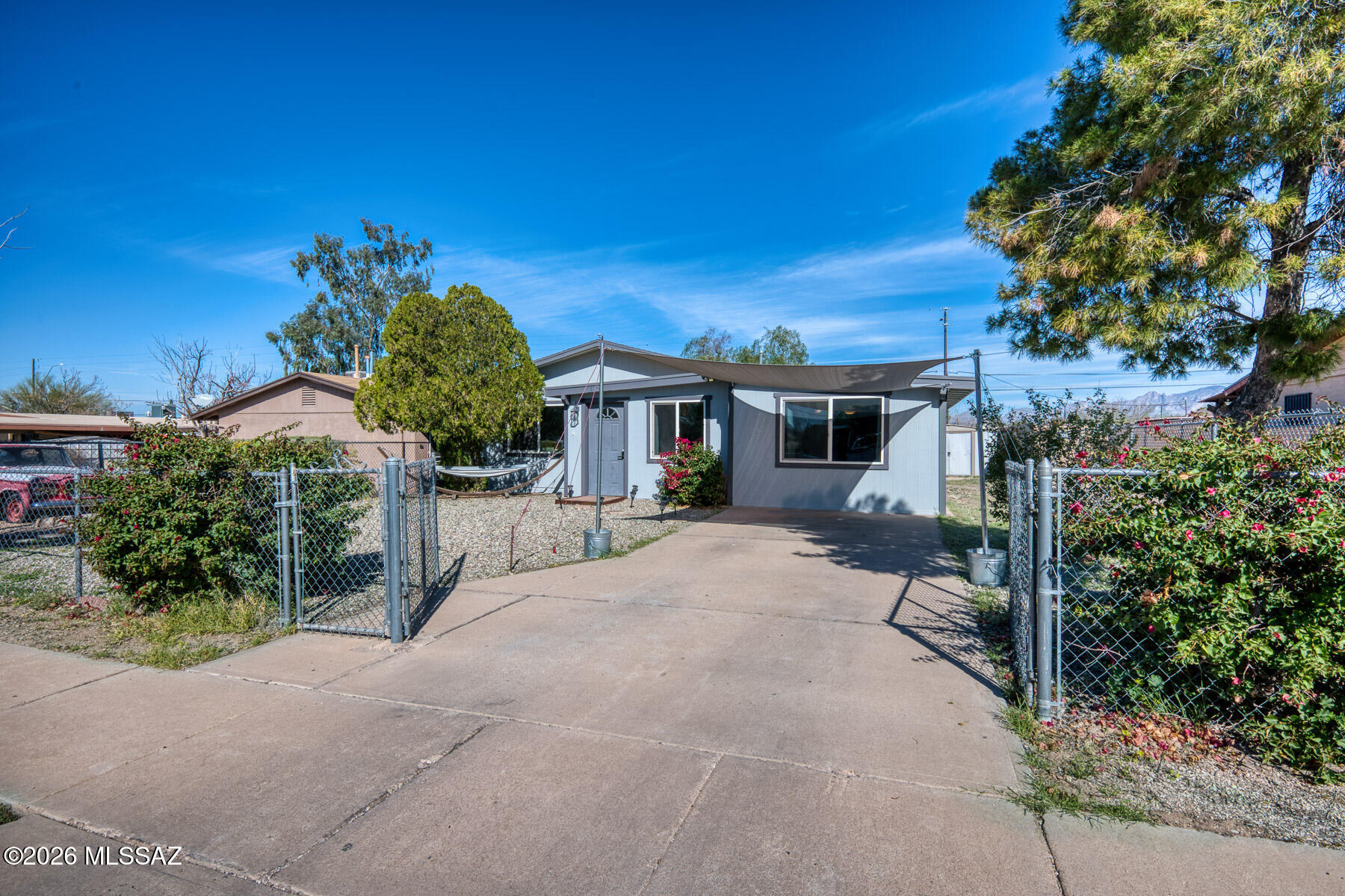 ***Seller will either convert den back into a third bedroom prior to COE or provide a credit to buyer for $3100 at closing for Buyer to perform work after COE.*** Move-in ready 2-bedroom, 2-bath home with a den that can easily be converted back into a 3rd bedroom. The fully fenced yard offers privacy and flexible outdoor space for pets or entertaining. Within walking distance to Silverlake Park, enjoy convenient access to the city pool, recreation center, and library. Ideally situated just a short drive from downtown Tucson, the University of Arizona, Davis-Monthan Air Force Base, Tucson International Airport, and the Tucson Marketplace, providing quick access to major employers, shopping, entertainment, and dining.